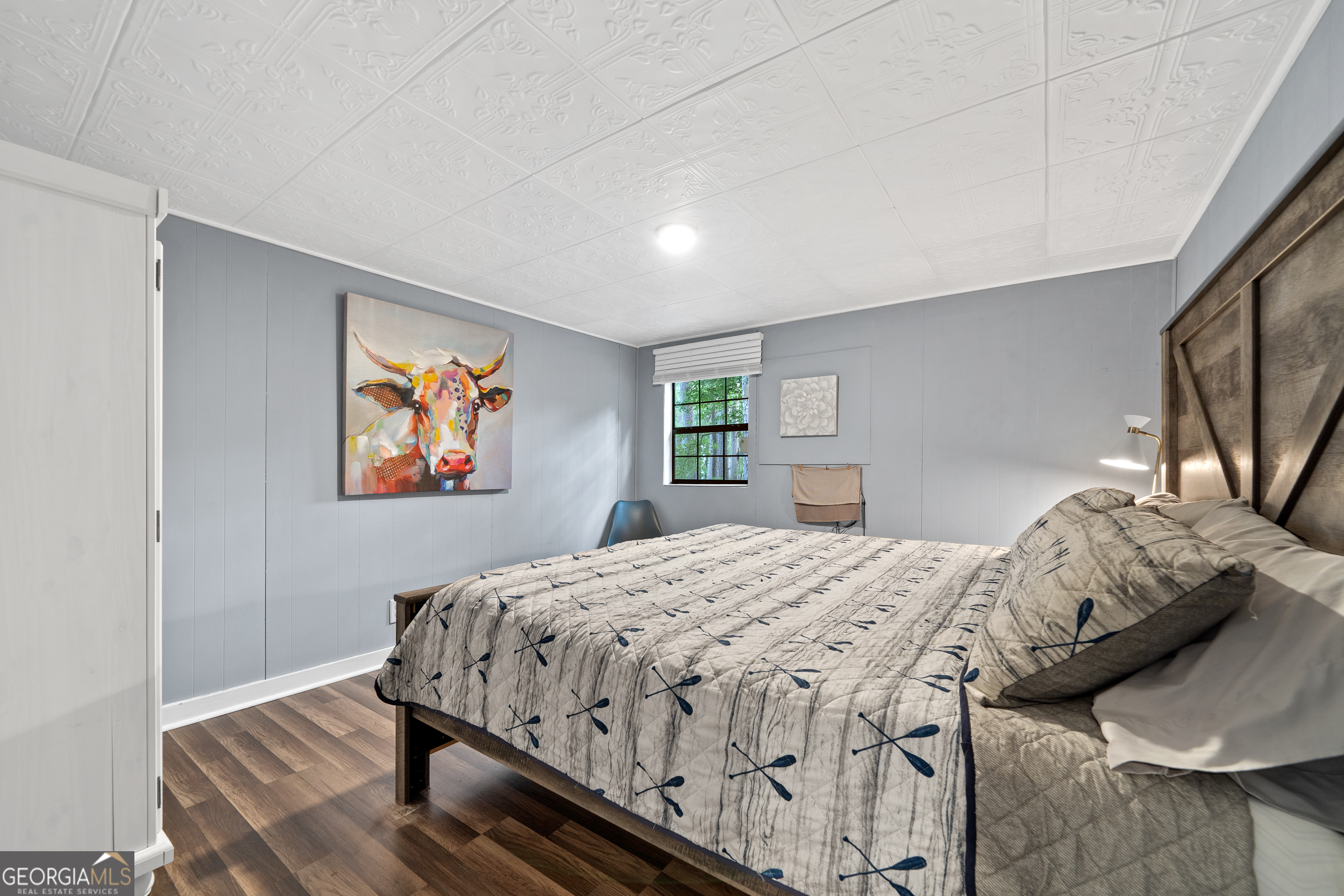 321 Barbara Point Road Sparta, GA 31087 - Photo 20 of 55 a bedroom with a bed and wooden floor