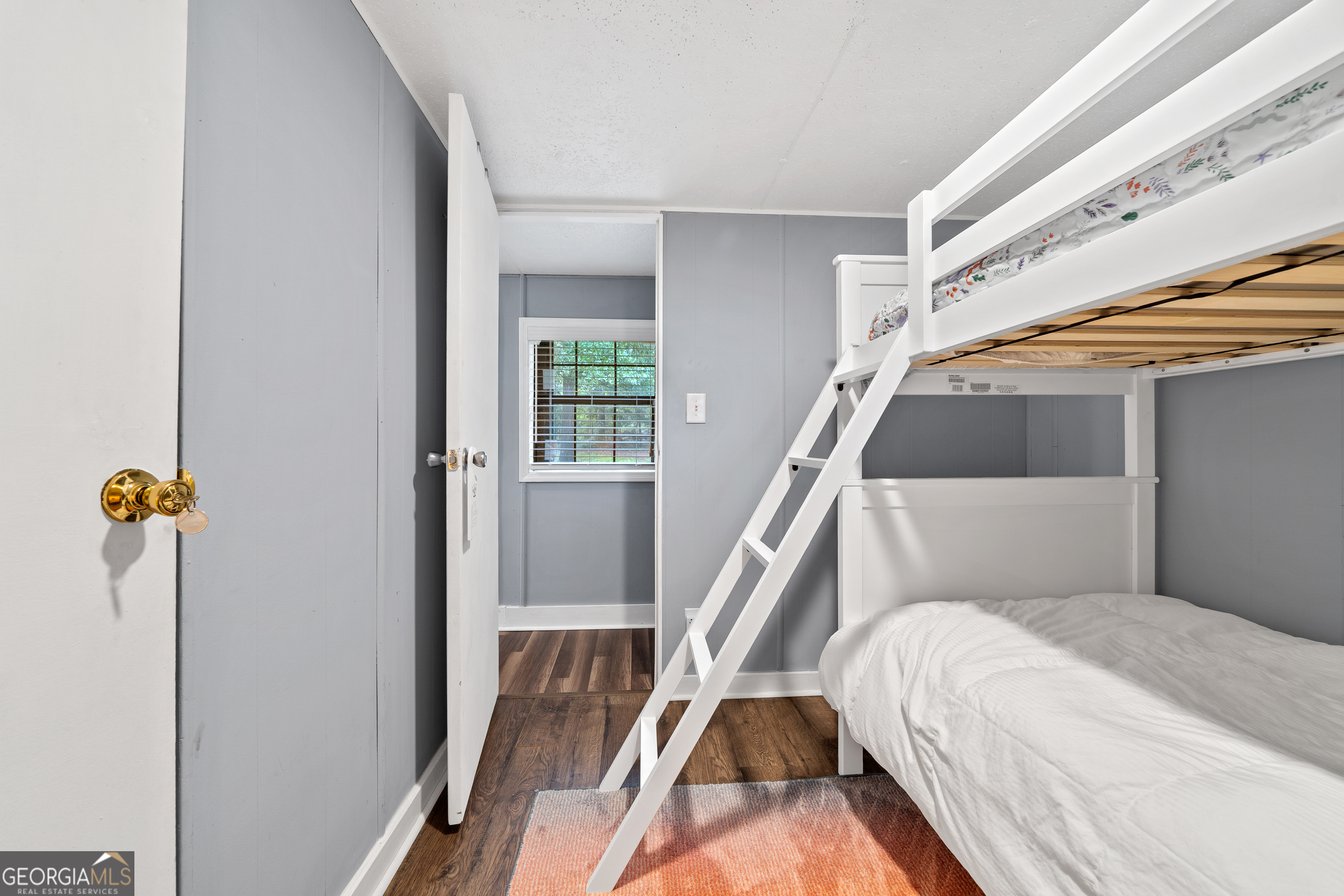321 Barbara Point Road Sparta, GA 31087 - Photo 23 of 55 a view of bedroom with furniture and staircase