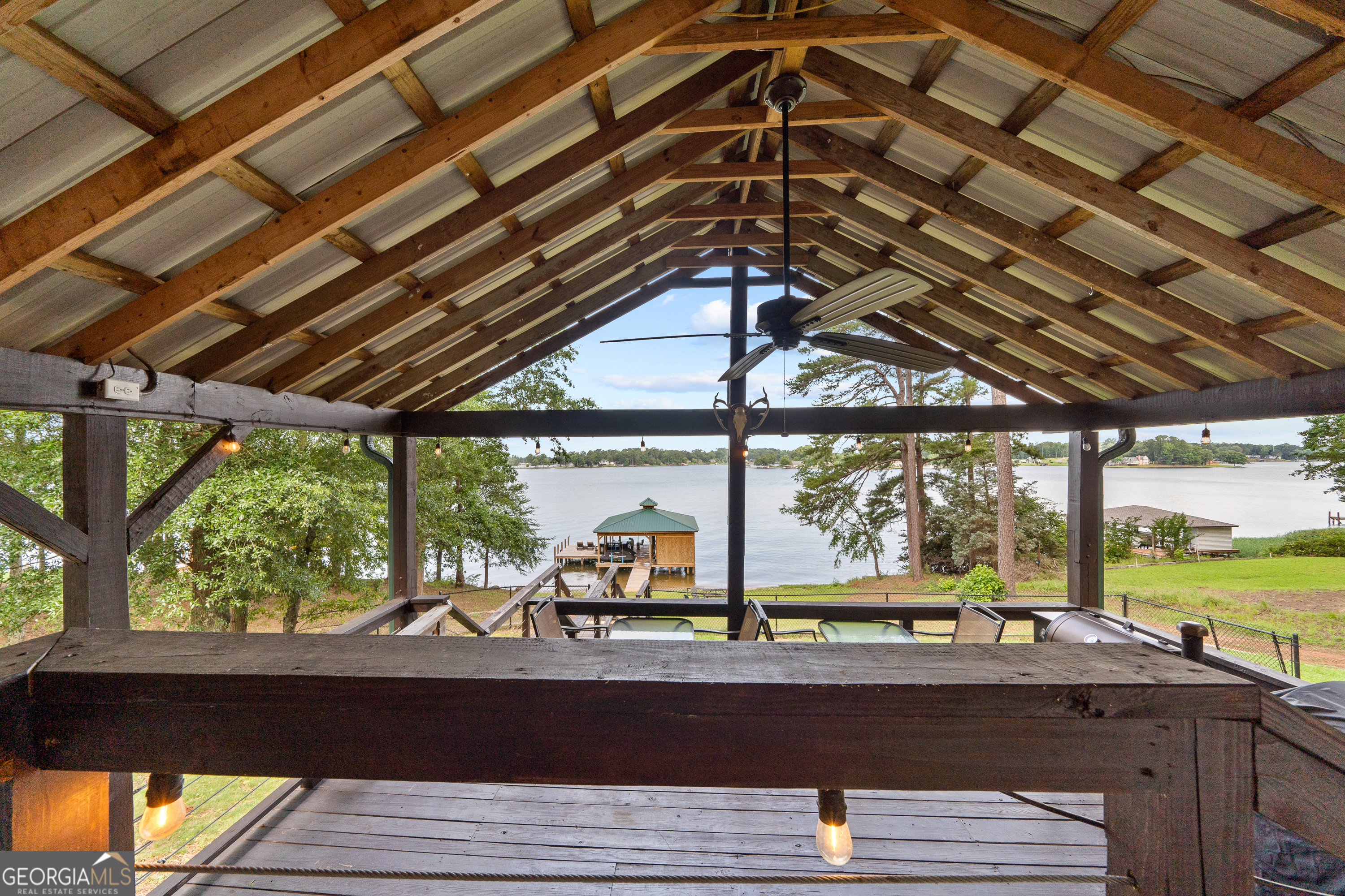 321 Barbara Point Road Sparta, GA 31087 - Photo 31 of 55 a view of a swimming pool with a outdoor seating