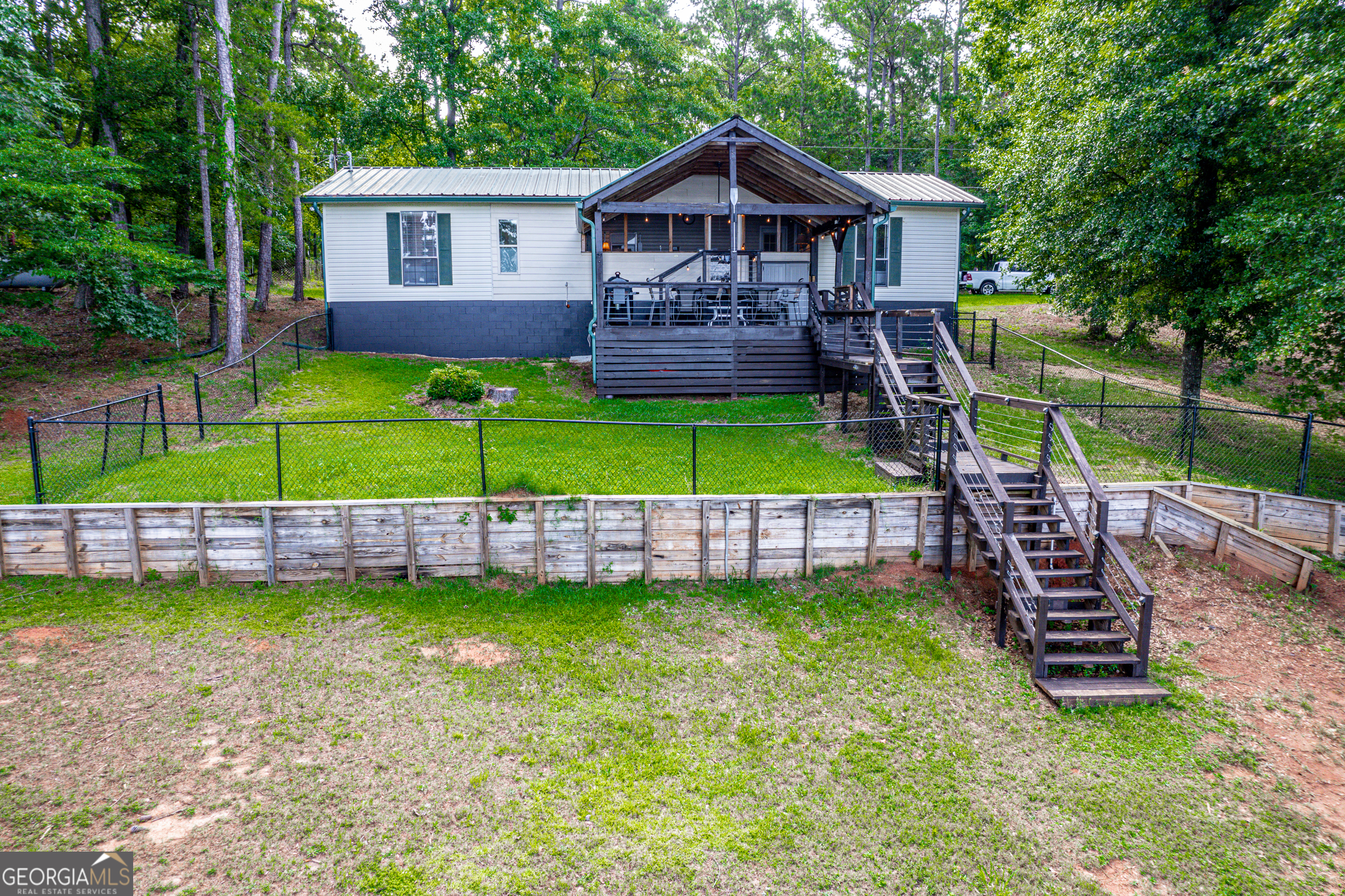 321 Barbara Point Road Sparta, GA 31087 - Photo 34 of 55 a front view of a house with garden