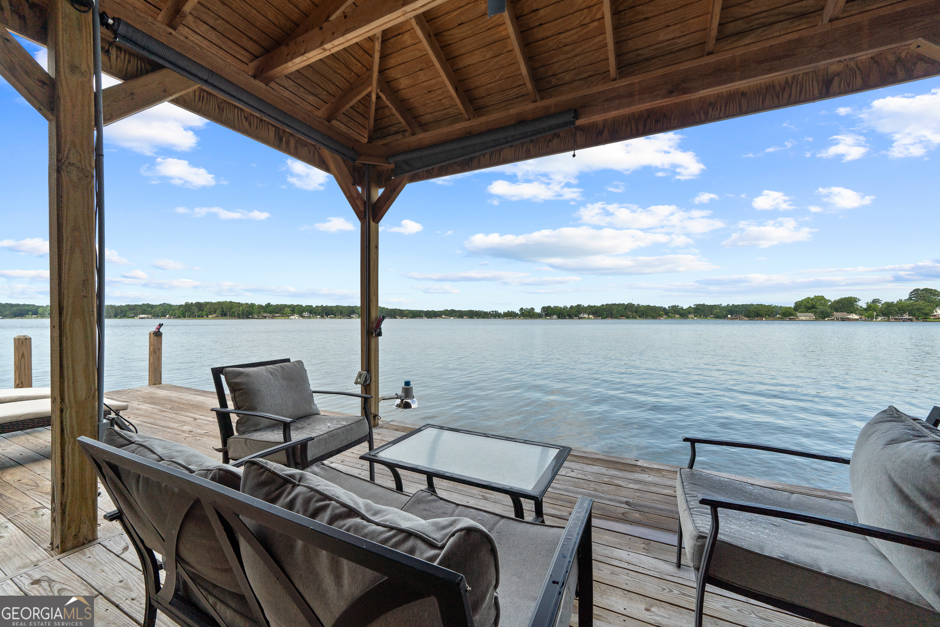 321 Barbara Point Road Sparta, GA 31087 - Photo 4 of 55 a view of a outdoor seating area with furniture
