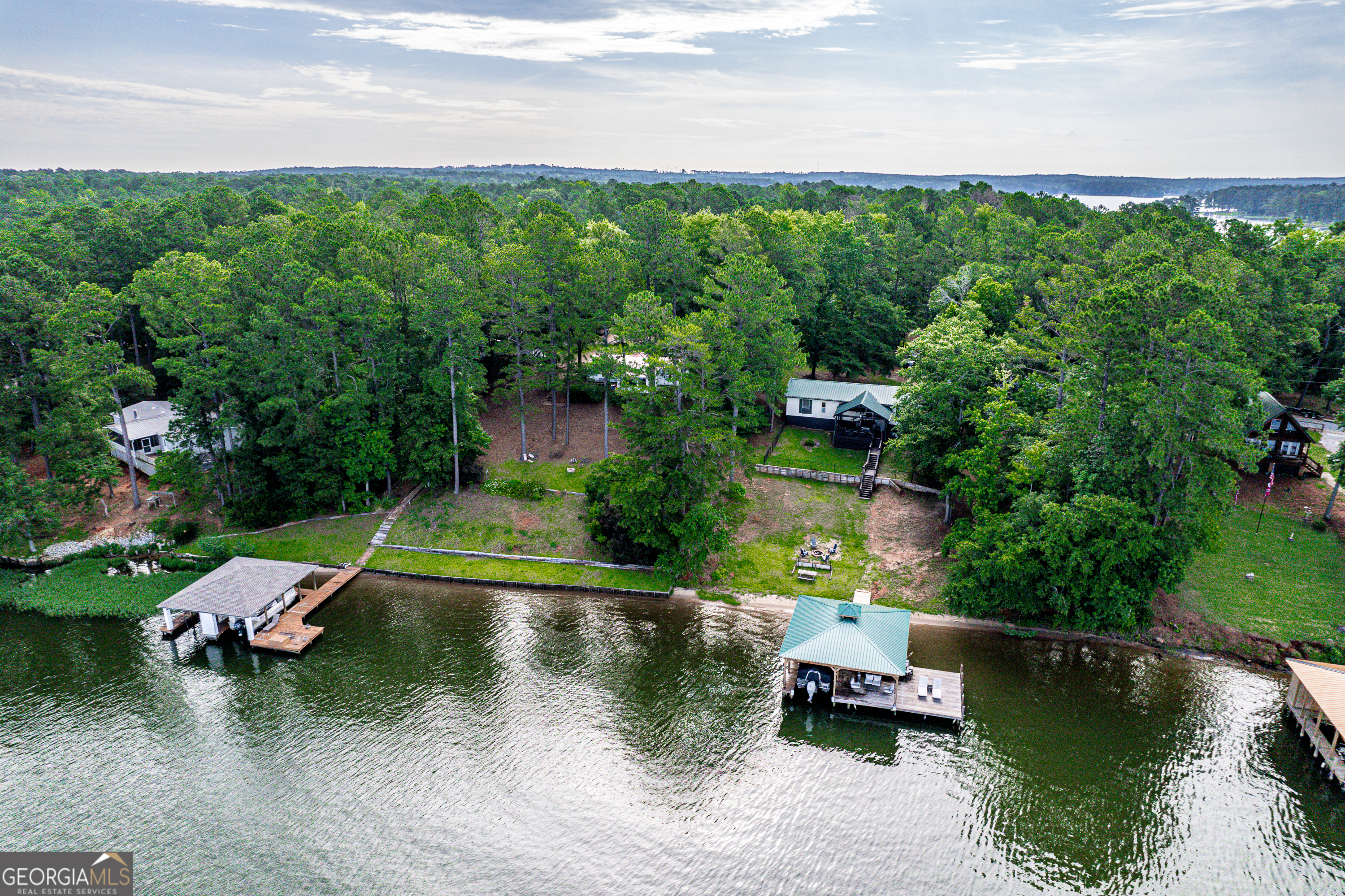 321 Barbara Point Road Sparta, GA 31087 - Photo 46 of 55 an aerial view of a house with a yard basket ball court and outdoor seating