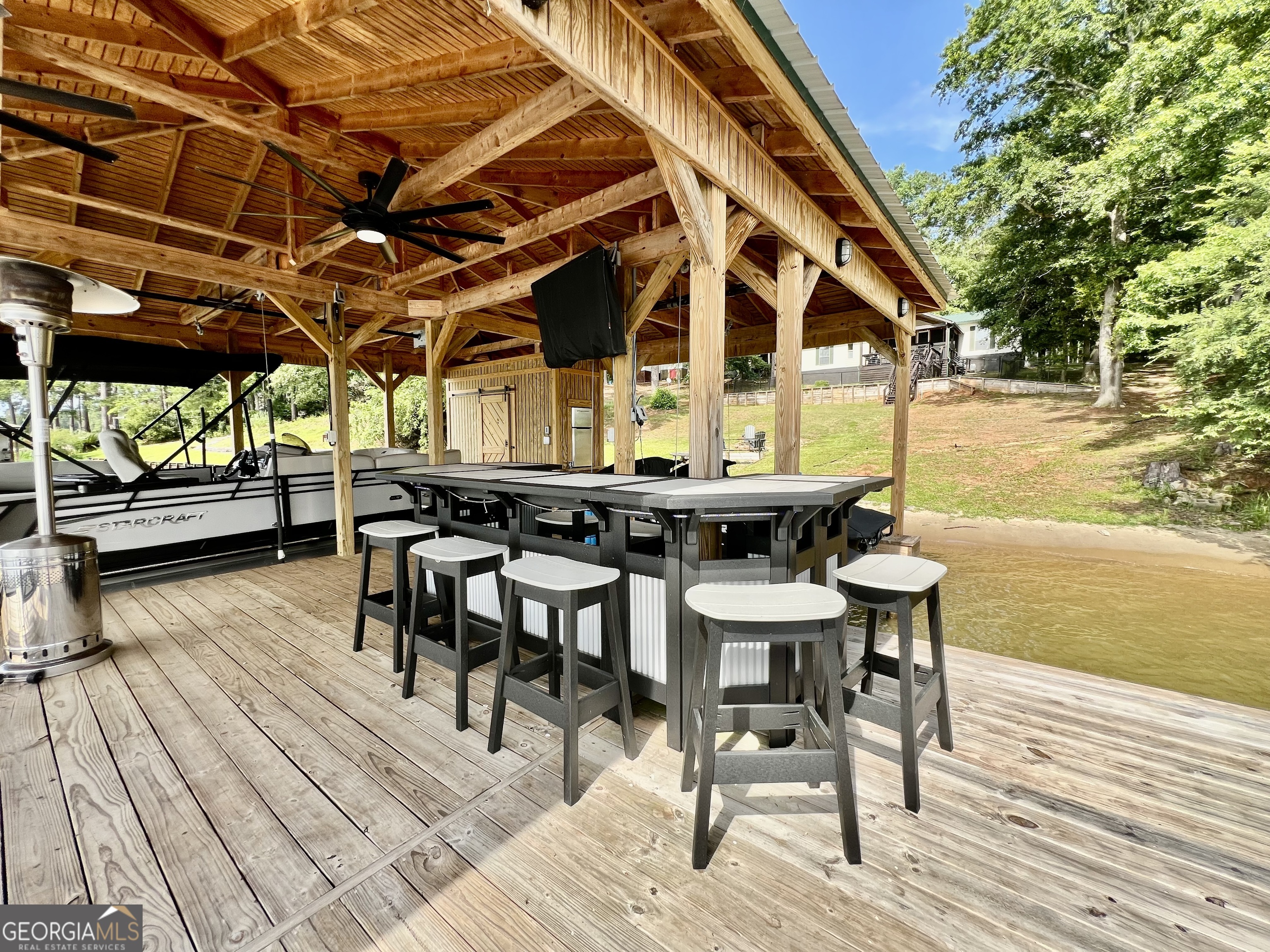 321 Barbara Point Road Sparta, GA 31087 - Photo 5 of 55 a view of a dining room with furniture and wooden floor