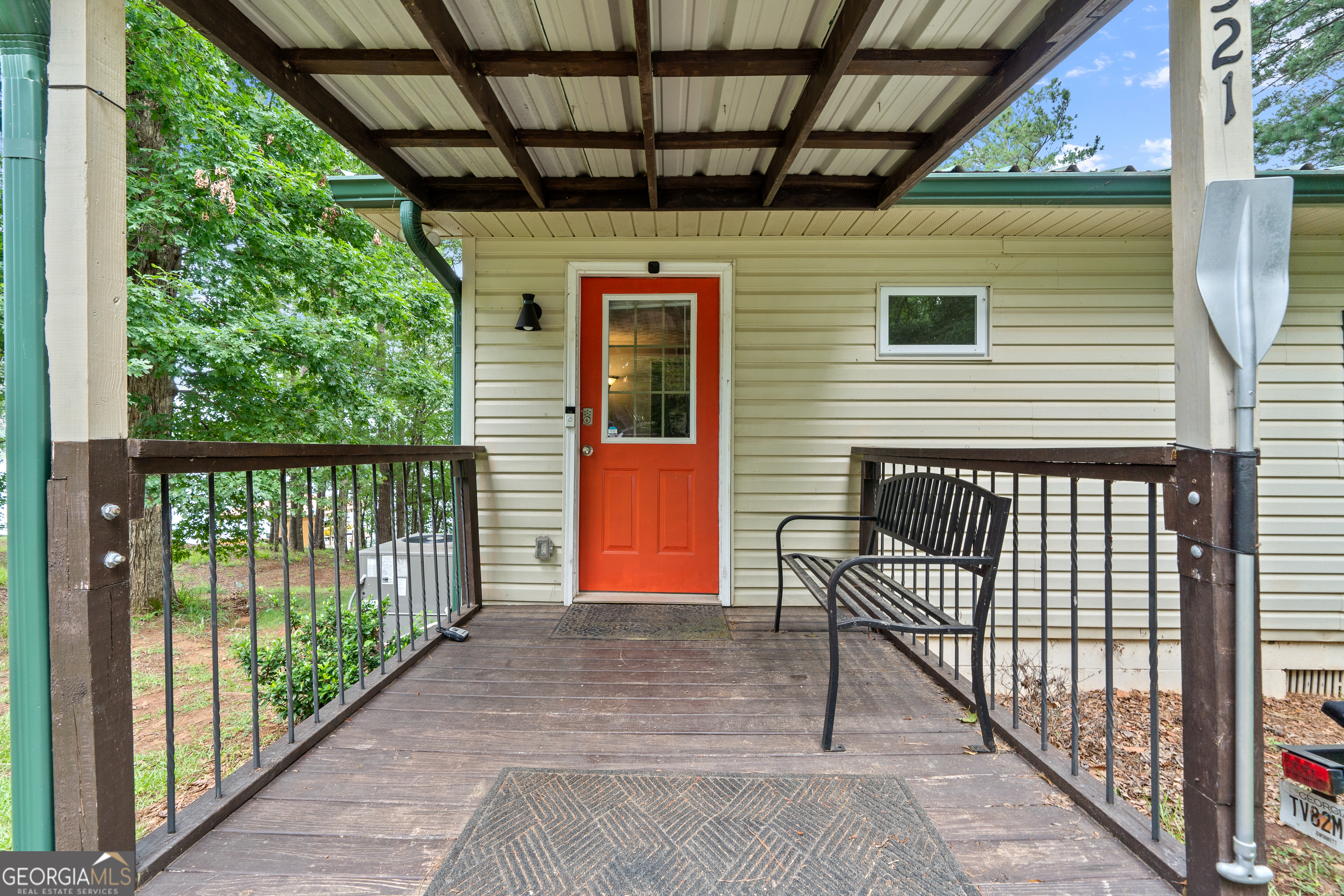 321 Barbara Point Road Sparta, GA 31087 - Photo 6 of 55 a view of a porch with wooden floor