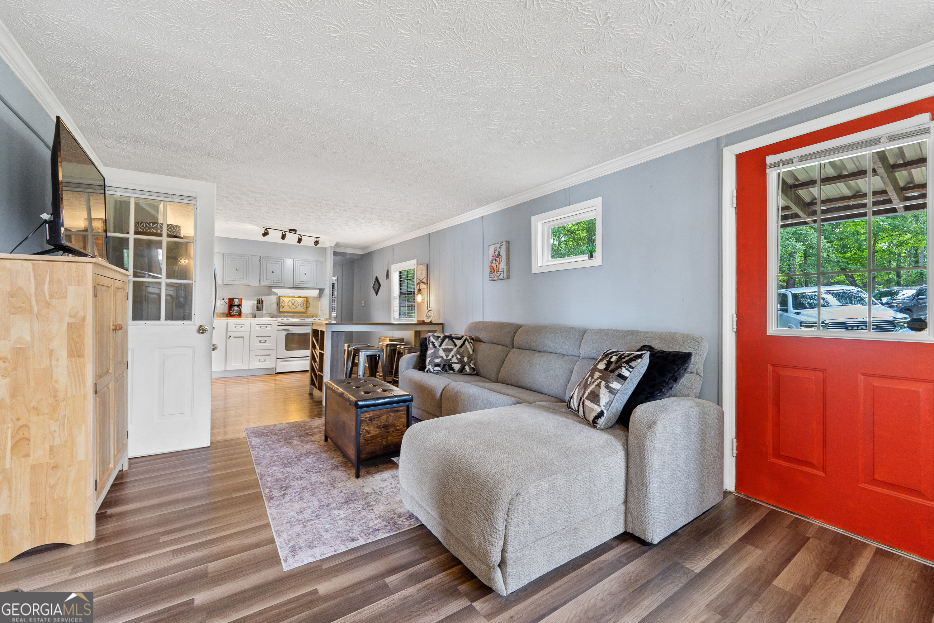 321 Barbara Point Road Sparta, GA 31087 - Photo 8 of 55 a living room with furniture and a flat screen tv