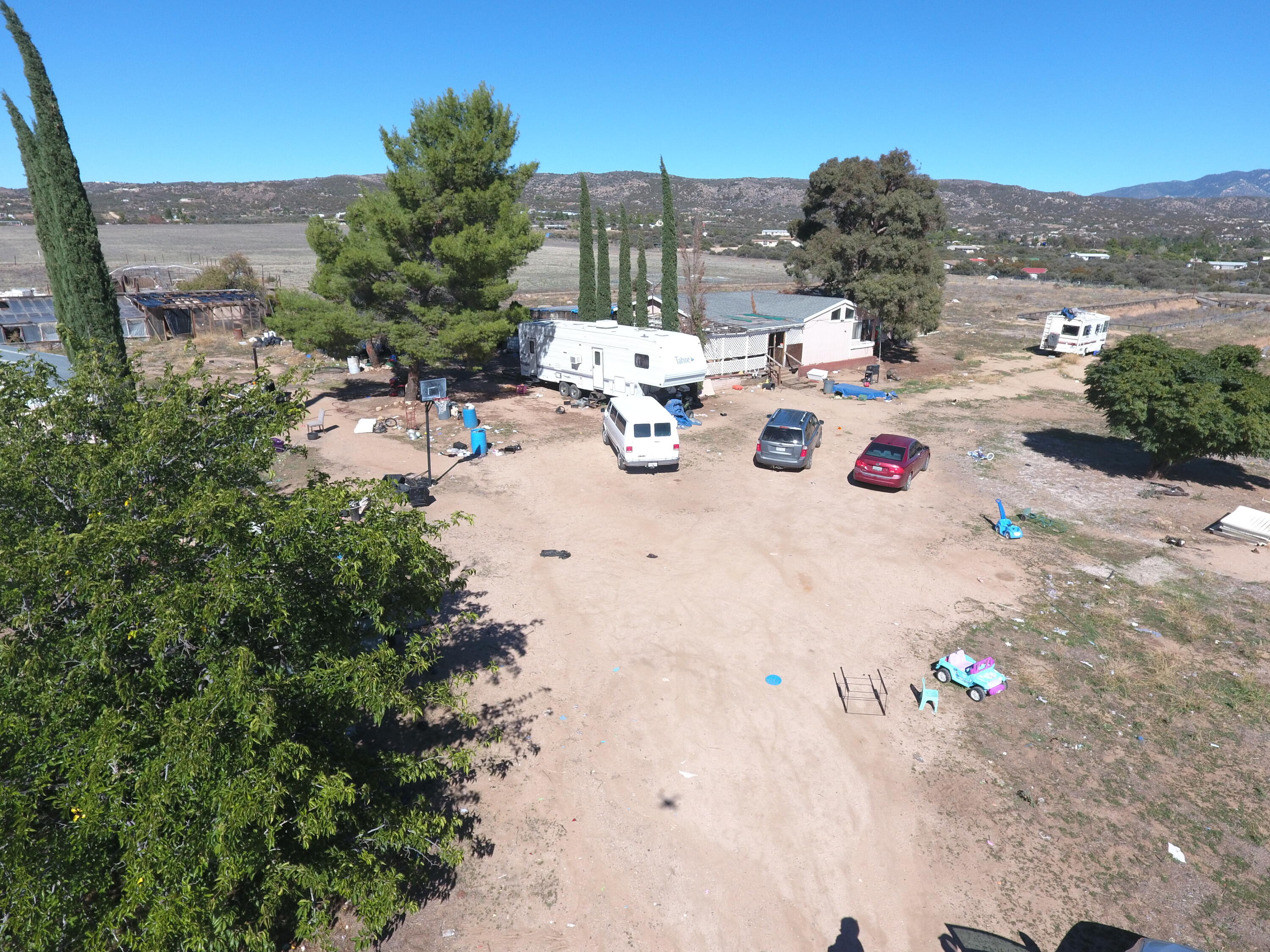 a view of backyard of the house with outdoor seating