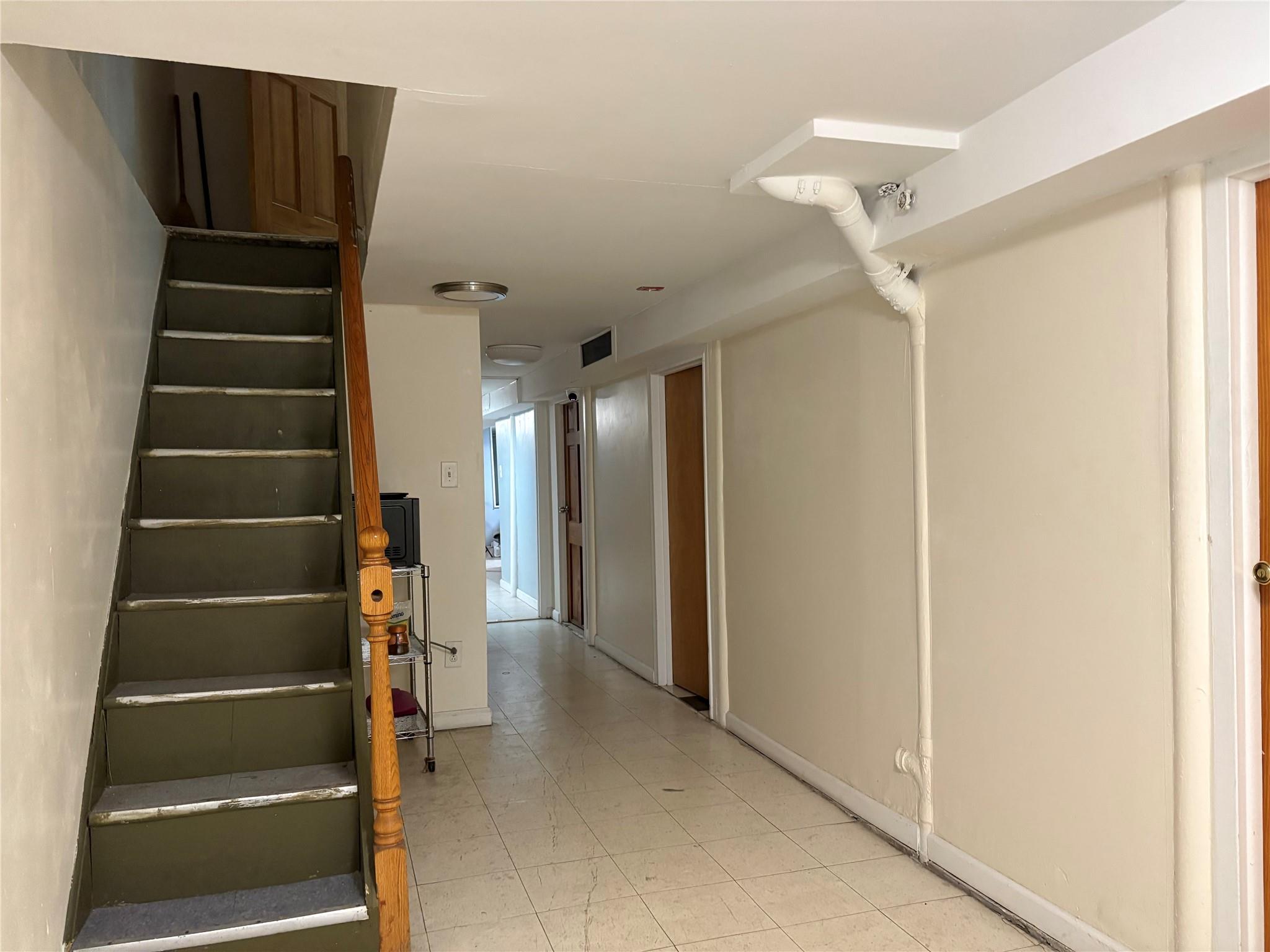 262 Grant Avenue Brooklyn, NY 11208 - Photo 14 of 14 a view of an entryway with wooden floor