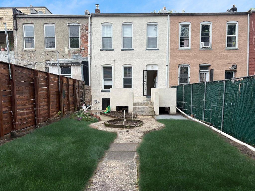 262 Grant Avenue Brooklyn, NY 11208 - Photo 2 of 14 a front view of a house with garden