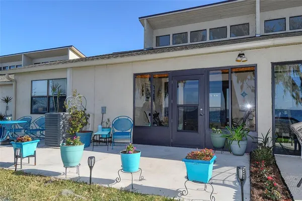 a front view of a house with outdoor seating