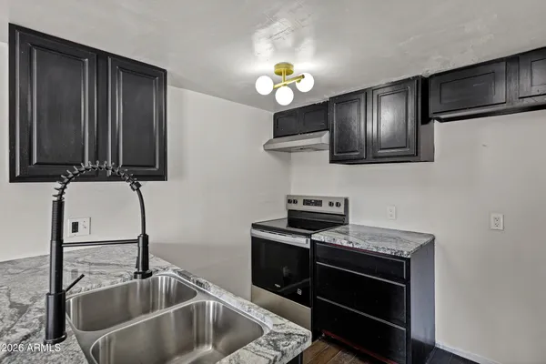 a close view of a sink and dishwasher in a kitchen