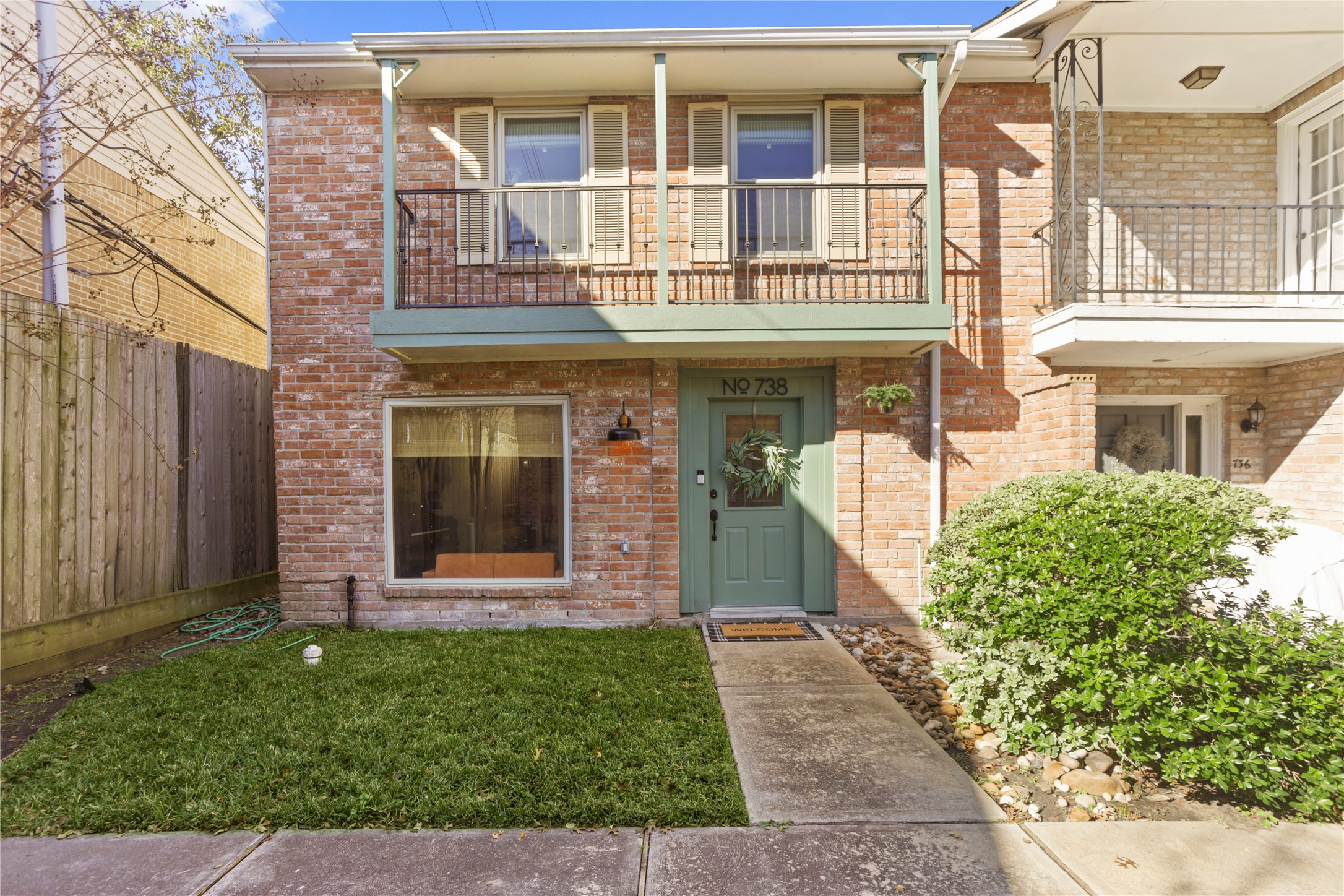 738 Thicket Lane Houston, TX 77079 - Photo 1 of 20 front view of a brick house with a small yard