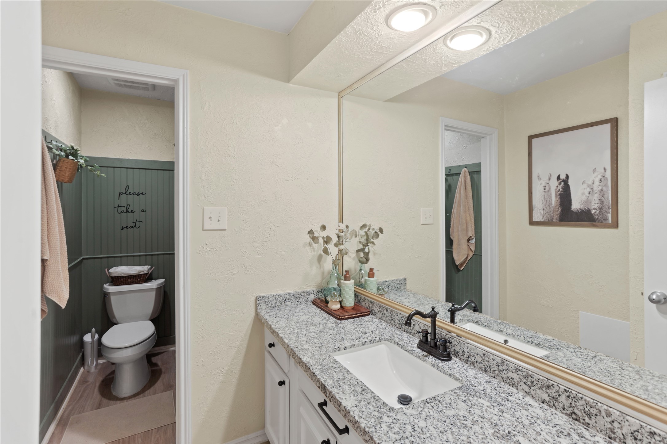 738 Thicket Lane Houston, TX 77079 - Photo 16 of 20 a bathroom with a granite countertop sink toilet and shower