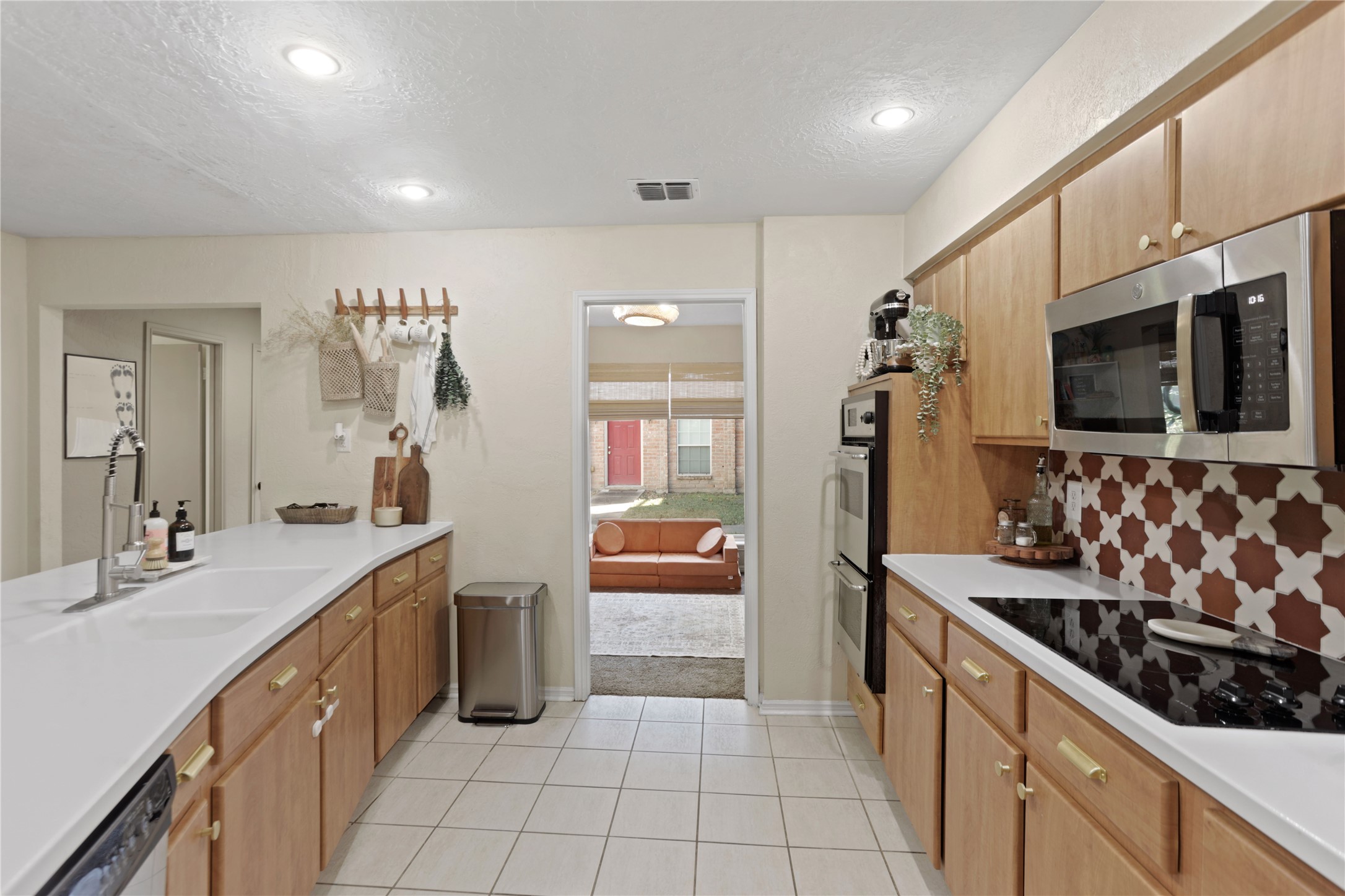 738 Thicket Lane Houston, TX 77079 - Photo 2 of 20 a kitchen with stainless steel appliances kitchen island granite countertop a sink and cabinets