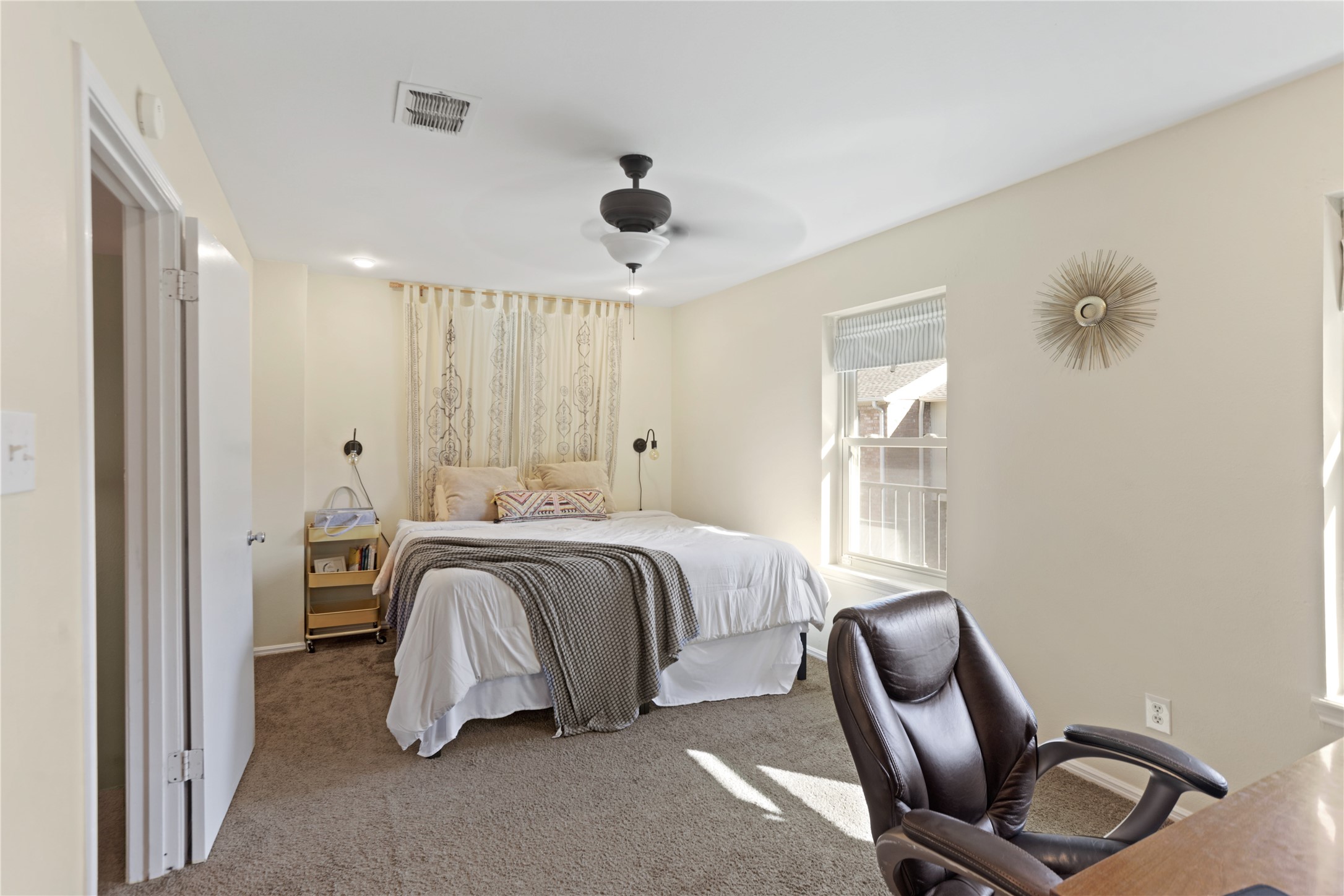 738 Thicket Lane Houston, TX 77079 - Photo 10 of 20 a spacious bedroom with a bed and a chandelier