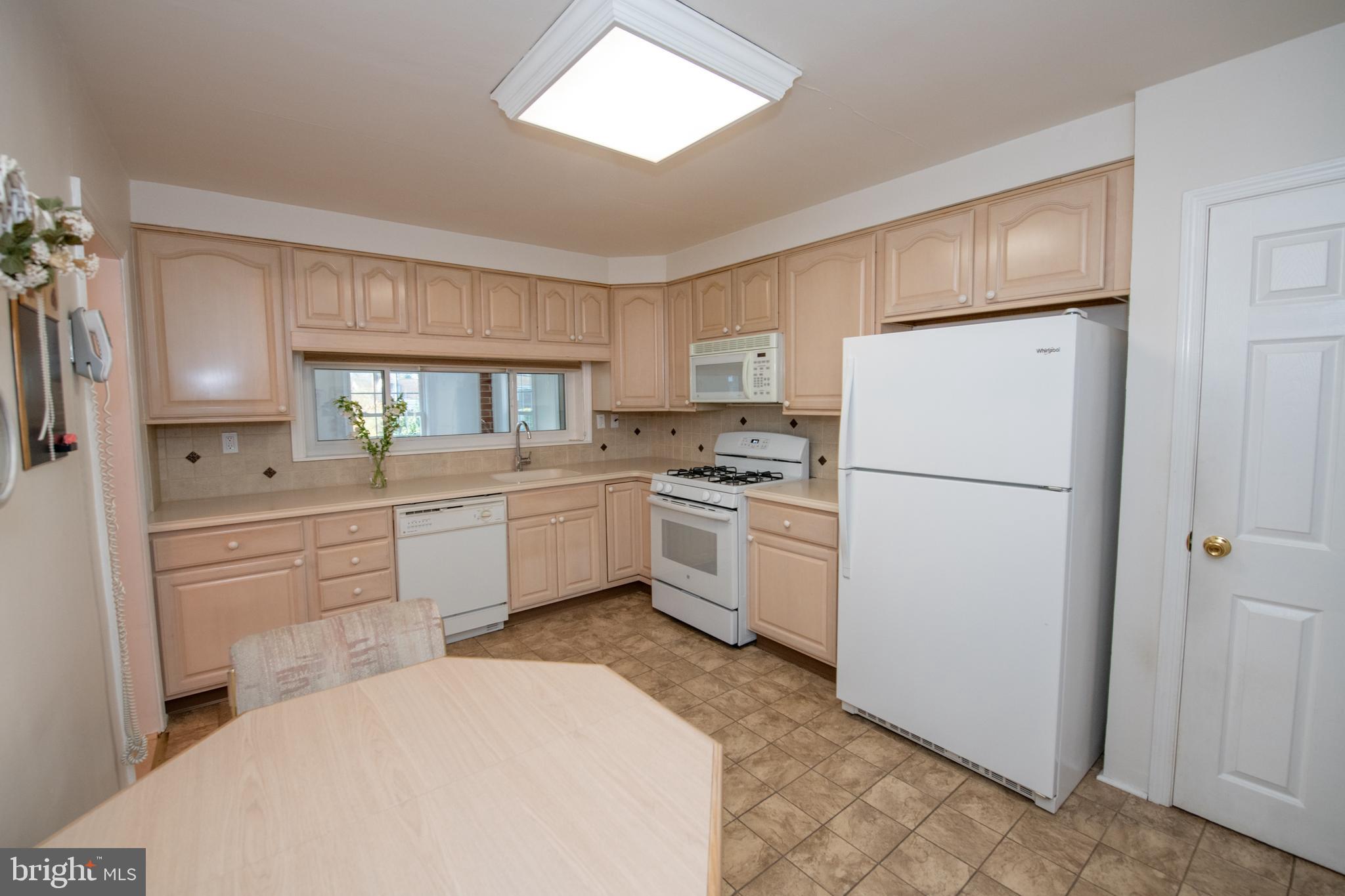 1836 Watson Road Abington, PA 19001 - Photo 7 of 22 a kitchen with a refrigerator a sink and dishwasher