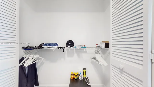 a living room filled with furniture and a potted plant