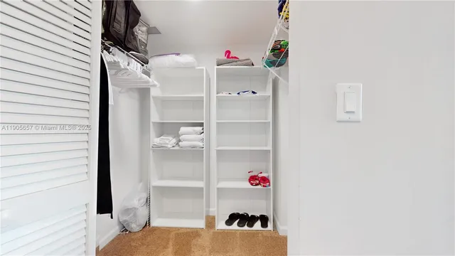 a view of a living room and chandelier