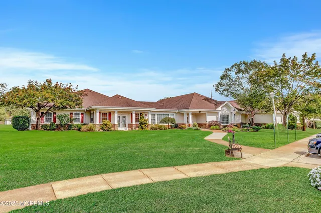 a view of a patio with a table and chairs