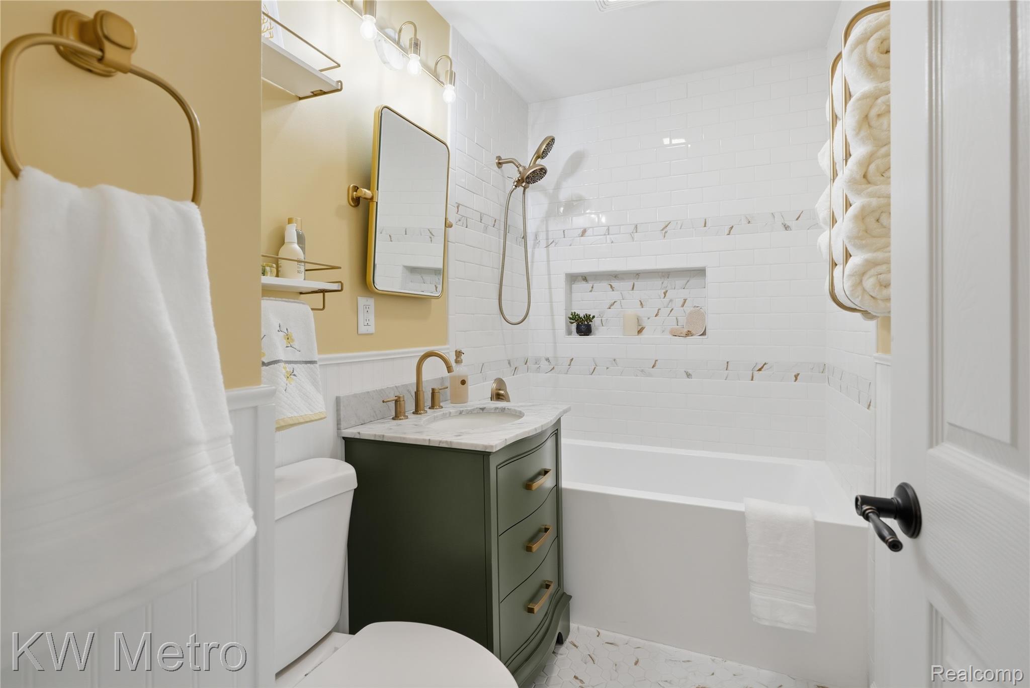 1861 Harvard Road Berkley, MI 48072 - Photo 15 of 27 Full bathroom featuring vanity, wainscoting, and washtub / shower combination