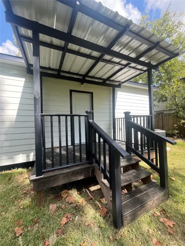 a view of staircase with wooden floor and fence