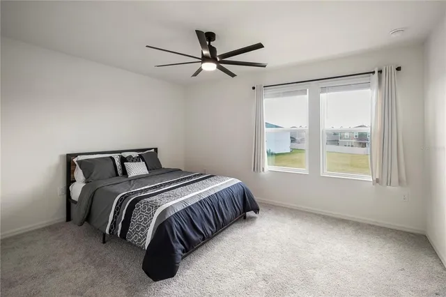 a bedroom with a bed and window