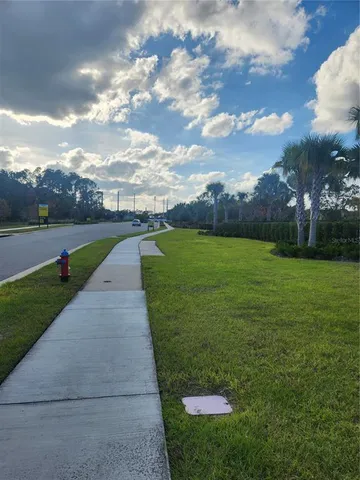 a terrace with outdoor seating and city view
