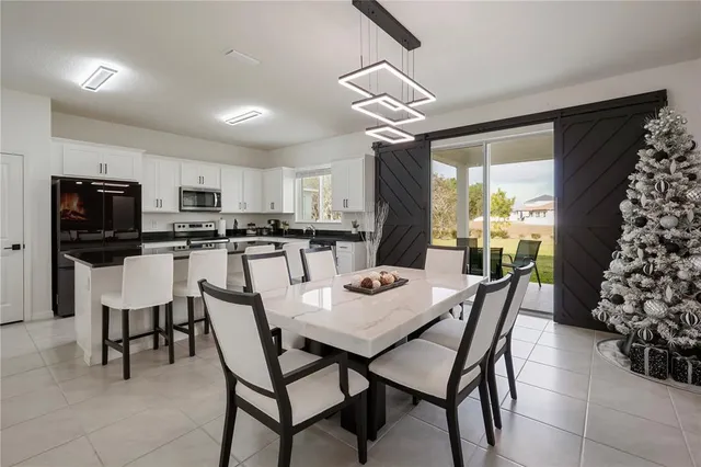 a dining room with furniture and window
