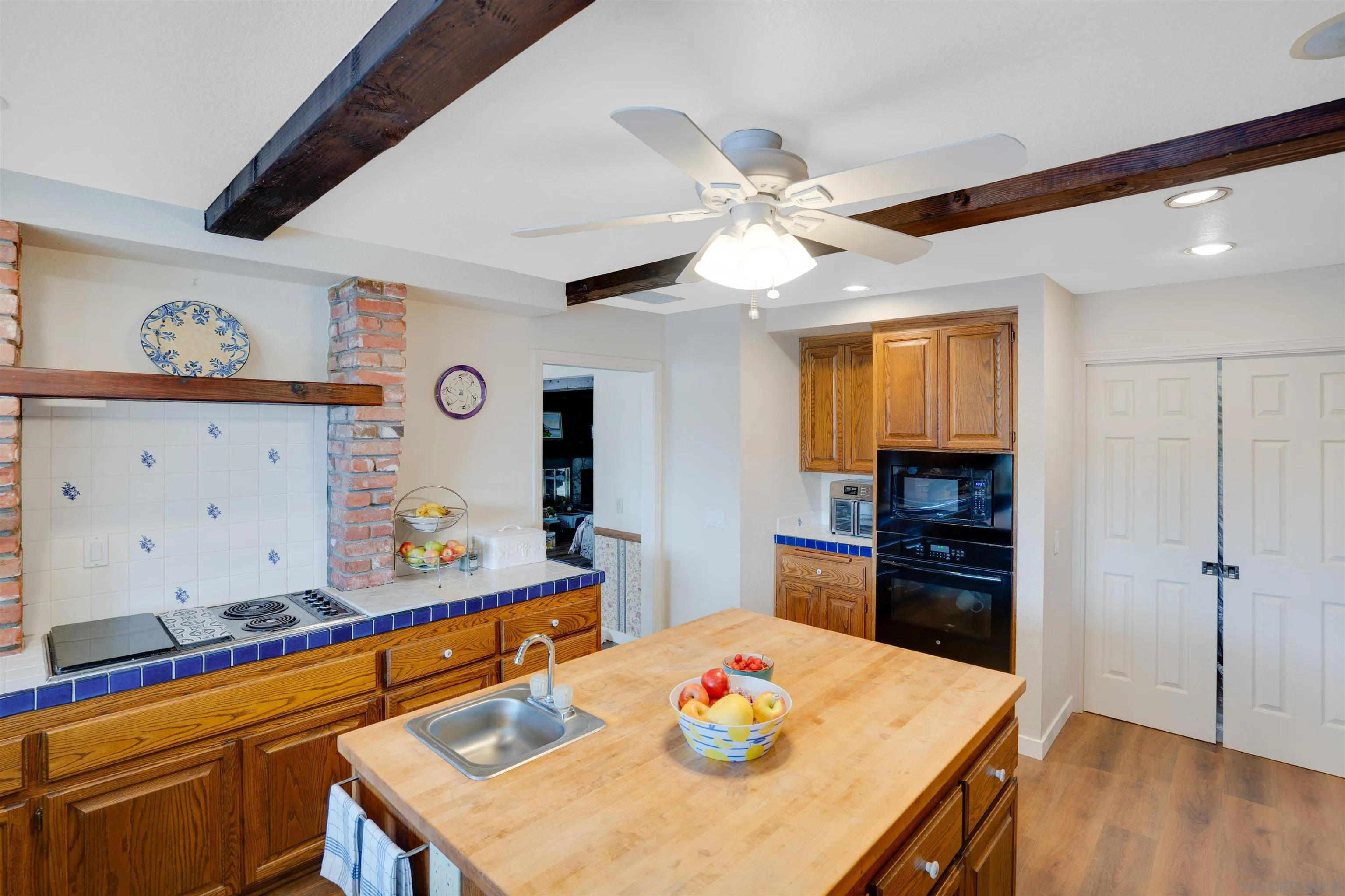 3675 Northcliff Drive Fallbrook, CA 92028 - Photo 15 of 37 a view of a dining room with furniture and wooden floor
