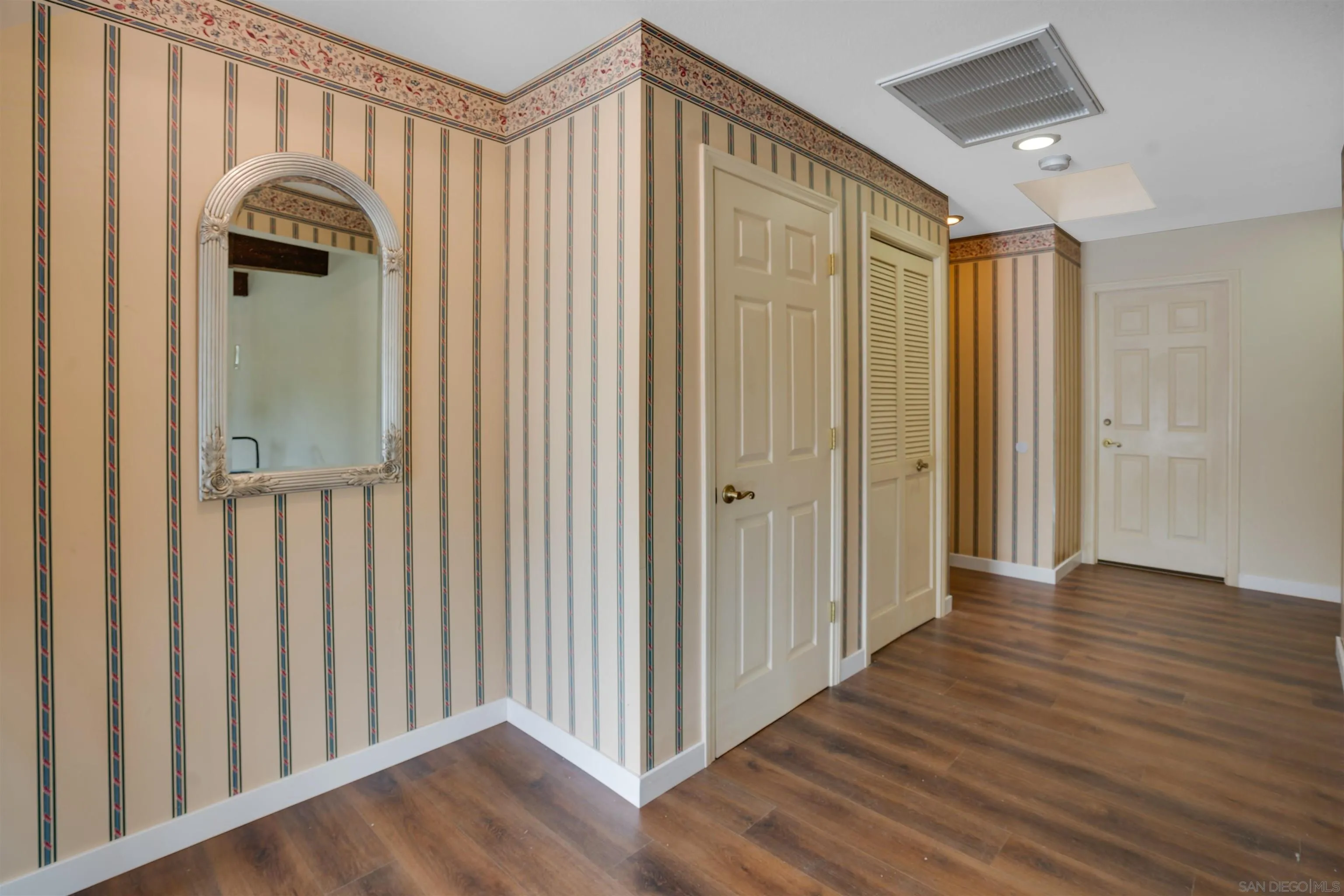 3675 Northcliff Drive Fallbrook, CA 92028 - Photo 19 of 37 a view of a hallway with wooden floor