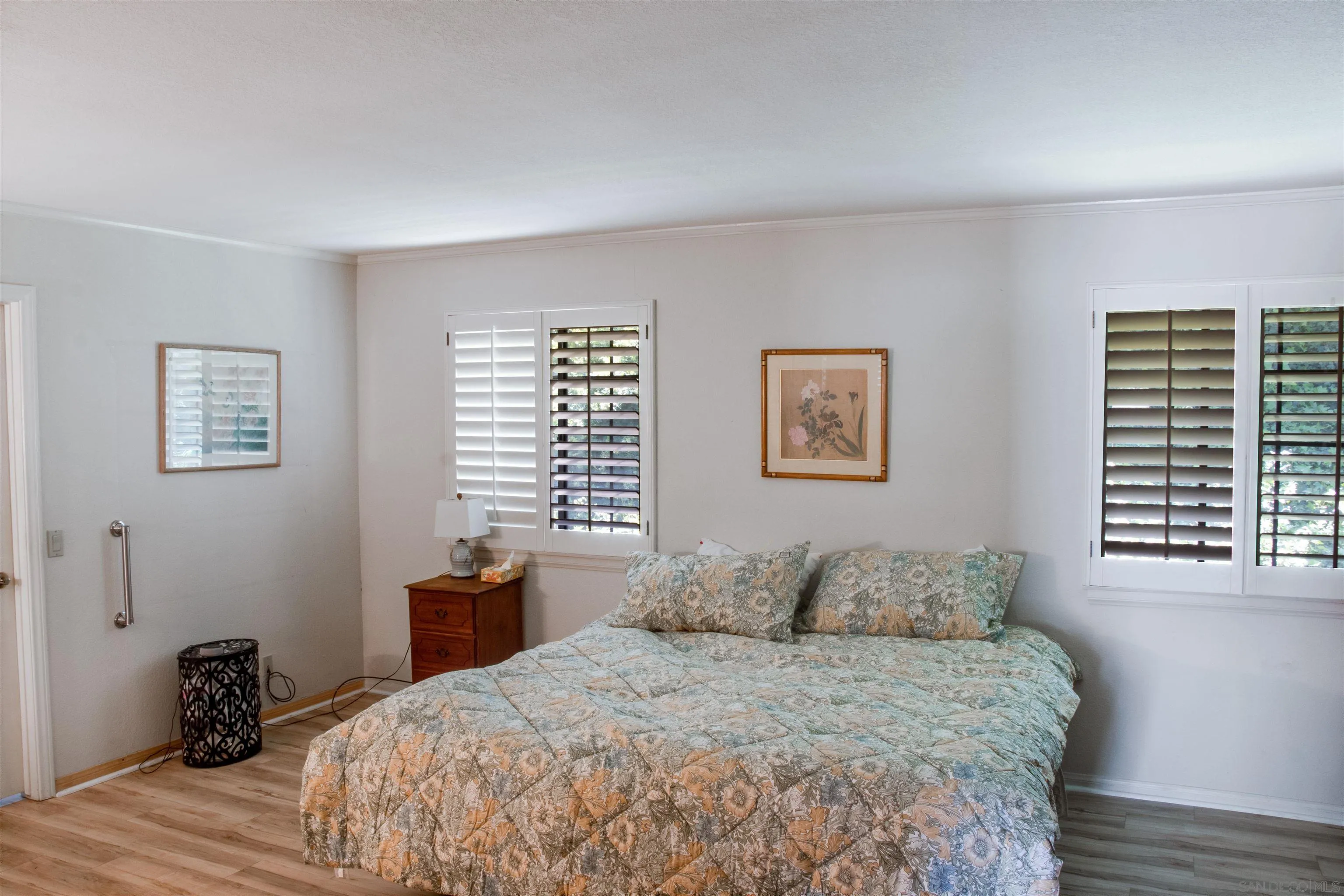 3675 Northcliff Drive Fallbrook, CA 92028 - Photo 20 of 37 a bedroom with a bed and wooden floor