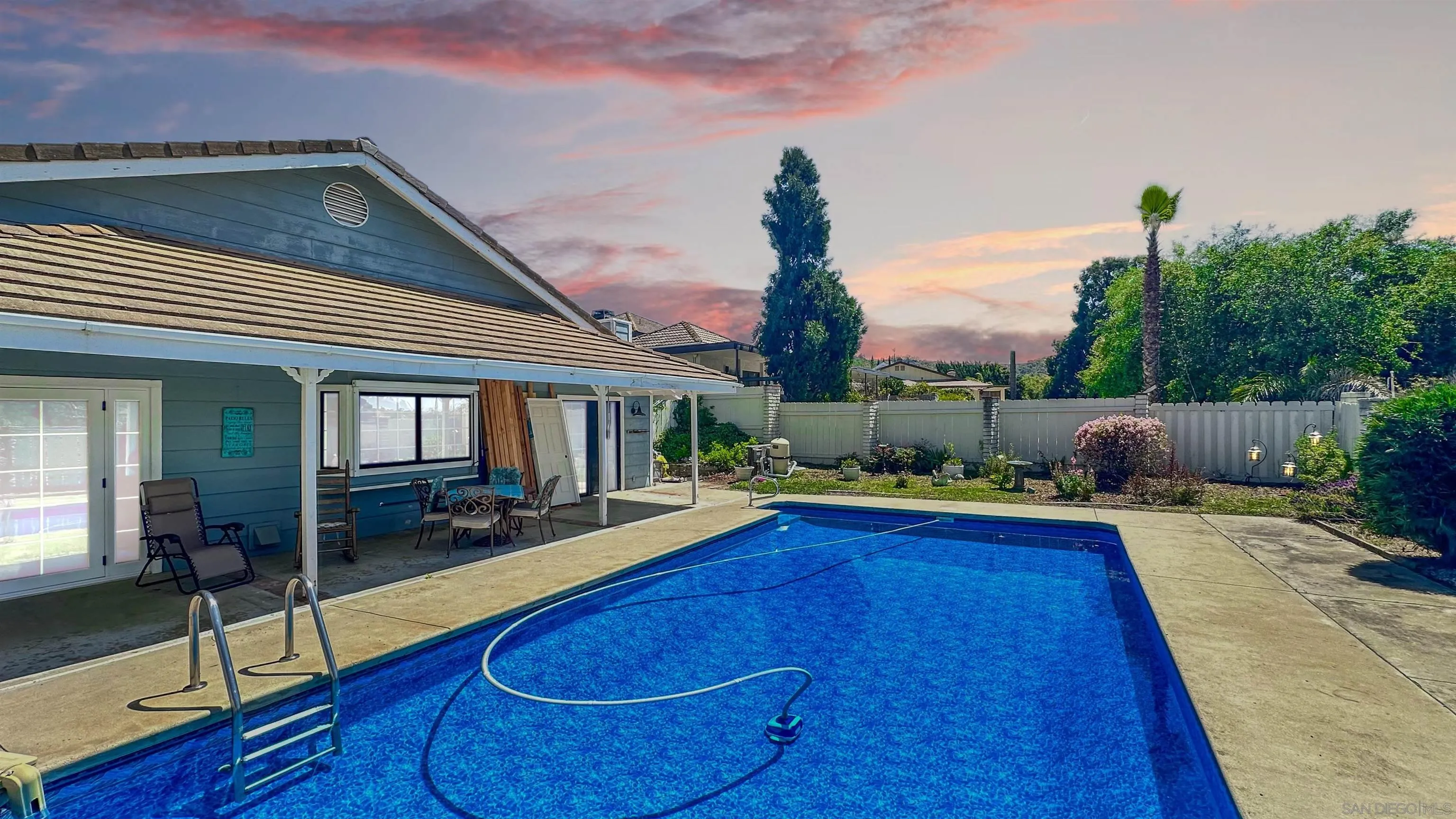 3675 Northcliff Drive Fallbrook, CA 92028 - Photo 31 of 37 a view of swimming pool with seating space and furniture in front of it
