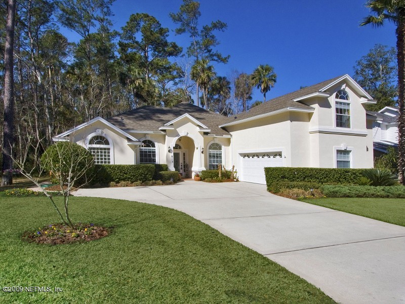 813 Mill Stream Road Ponte Vedra Beach, FL 32082 - Photo 1 of 22 a front view of a house with a yard and garage