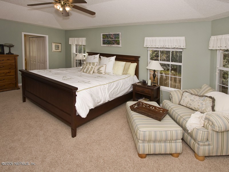 813 Mill Stream Road Ponte Vedra Beach, FL 32082 - Photo 12 of 22 a bedroom with furniture and a couch