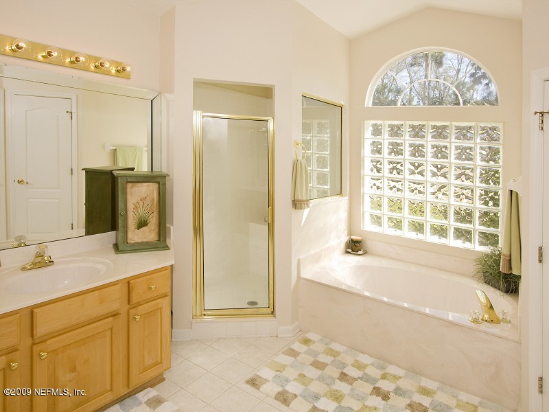 813 Mill Stream Road Ponte Vedra Beach, FL 32082 - Photo 14 of 22 a spacious bathroom with a tub sink and a shower