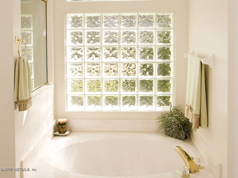813 Mill Stream Road Ponte Vedra Beach, FL 32082 - Photo 15 of 22 a bathroom with a bathtub and next to a window