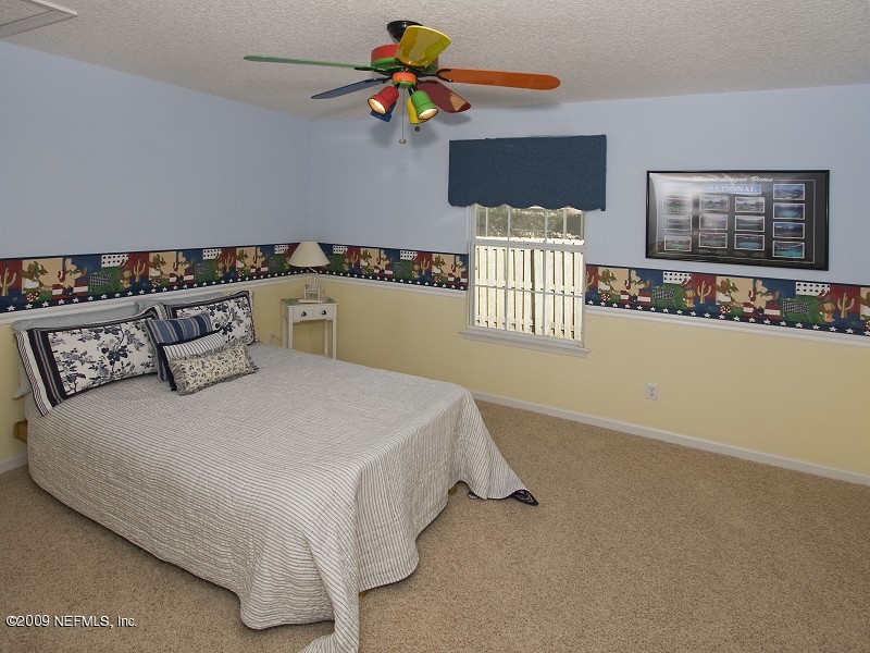 813 Mill Stream Road Ponte Vedra Beach, FL 32082 - Photo 18 of 22 a bedroom with a bed dresser and window