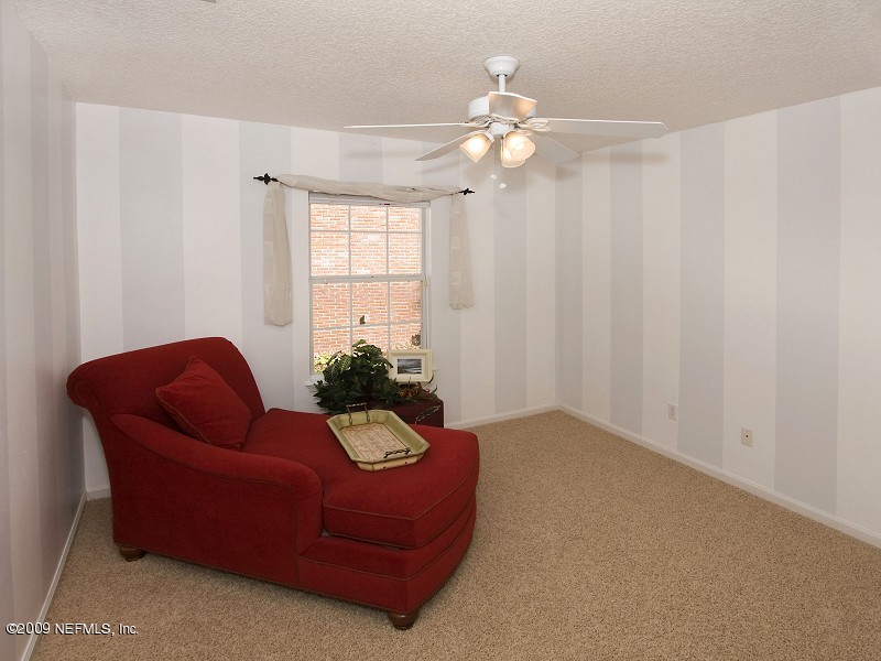 813 Mill Stream Road Ponte Vedra Beach, FL 32082 - Photo 19 of 22 a living room with furniture and a chandelier