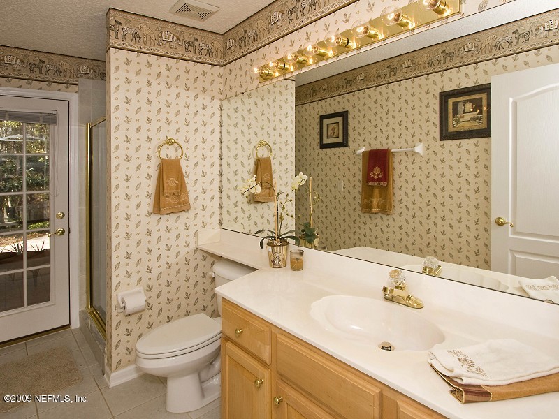 813 Mill Stream Road Ponte Vedra Beach, FL 32082 - Photo 20 of 22 a bathroom with a sink toilet and shower