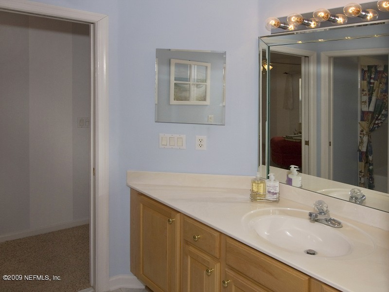 813 Mill Stream Road Ponte Vedra Beach, FL 32082 - Photo 21 of 22 a bathroom with a sink and a mirror