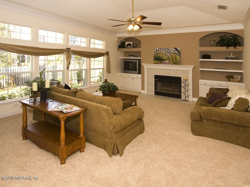 813 Mill Stream Road Ponte Vedra Beach, FL 32082 - Photo 7 of 22 a living room with furniture large window and fireplace
