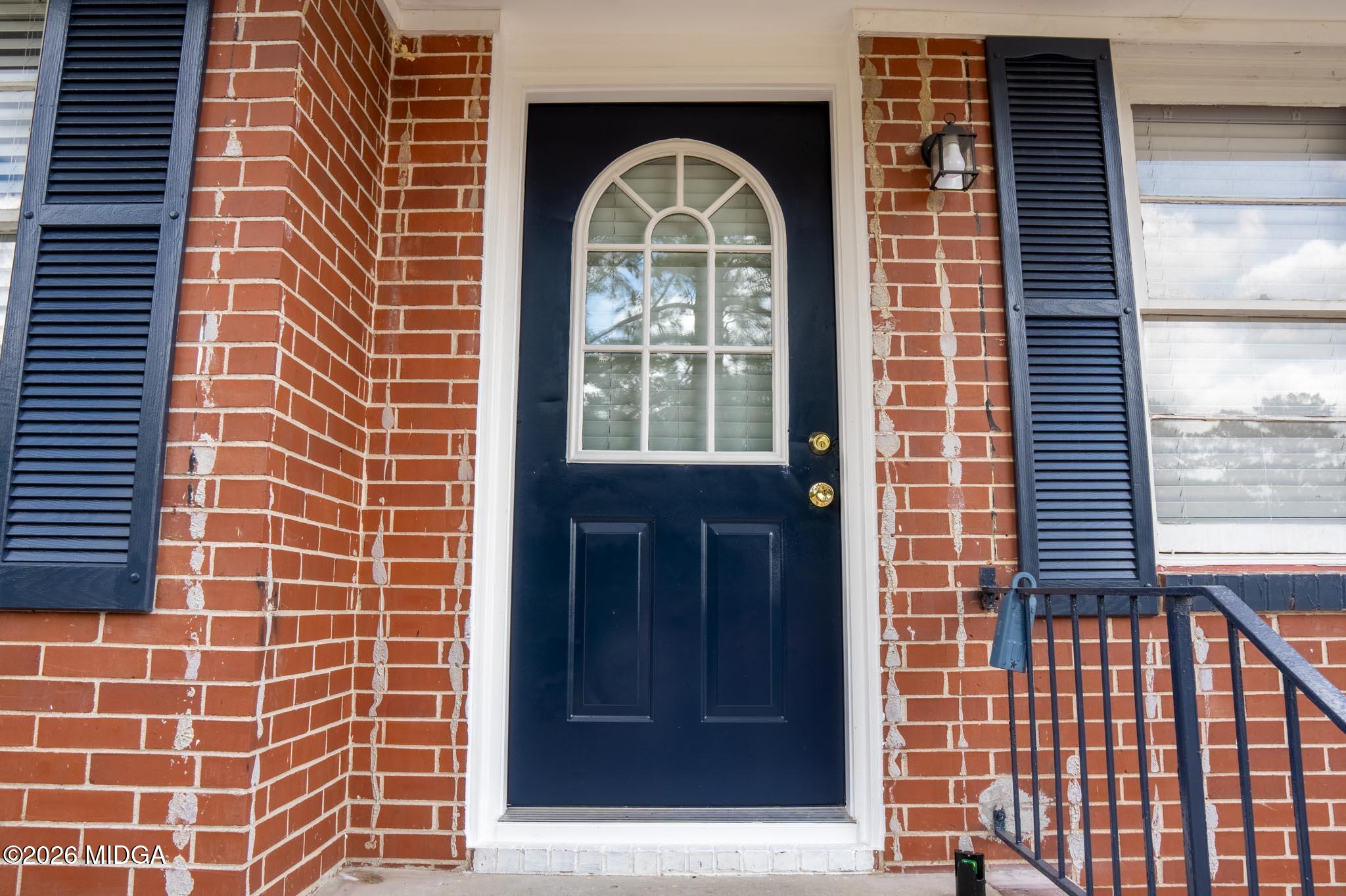 3319 Mohawk Road Macon, GA 31217 - Photo 11 of 38 a view of a brick house with a door