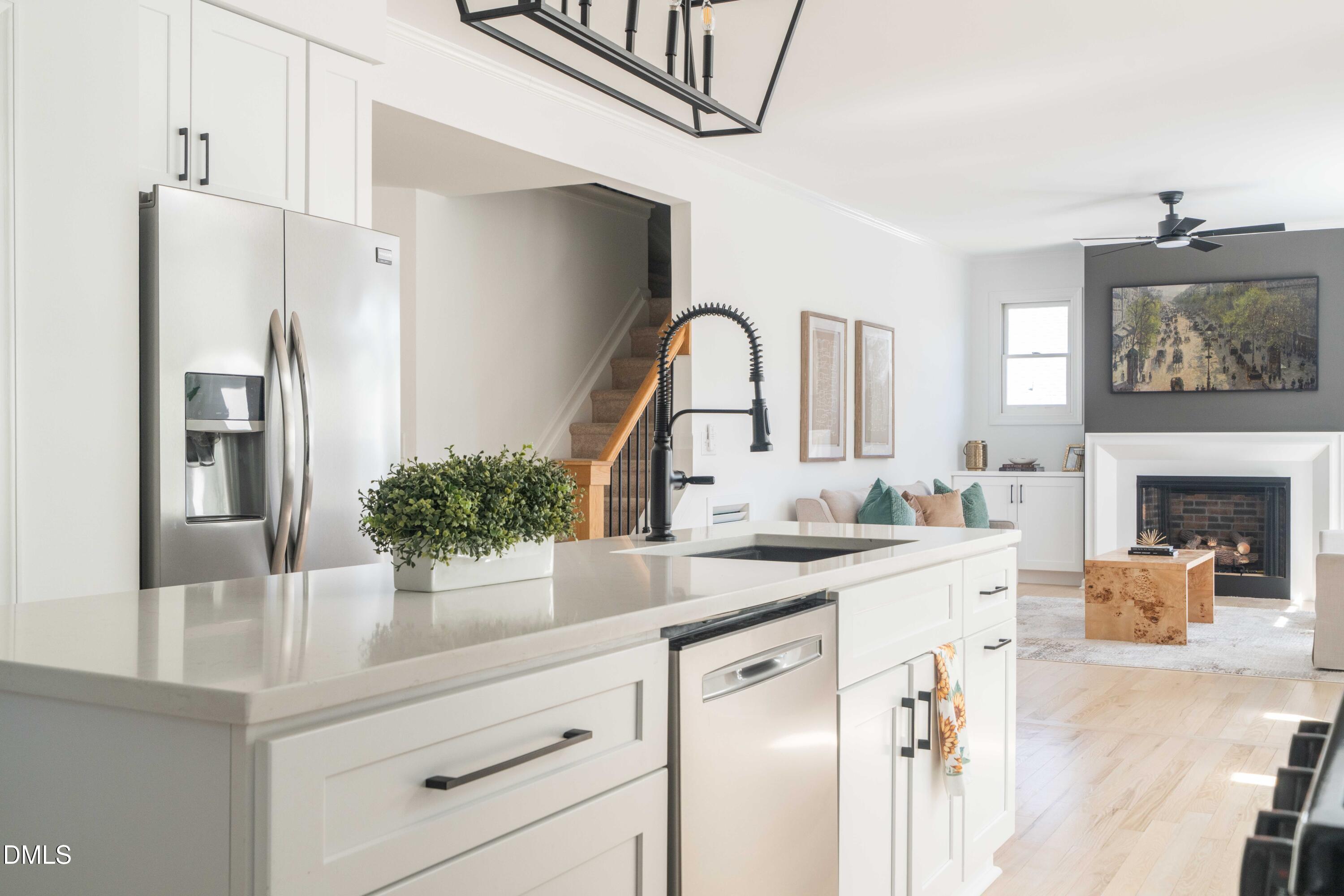 1512 Cooper Falls Lane Raleigh, NC 27614 - Photo 12 of 64 a kitchen with a sink and a refrigerator
