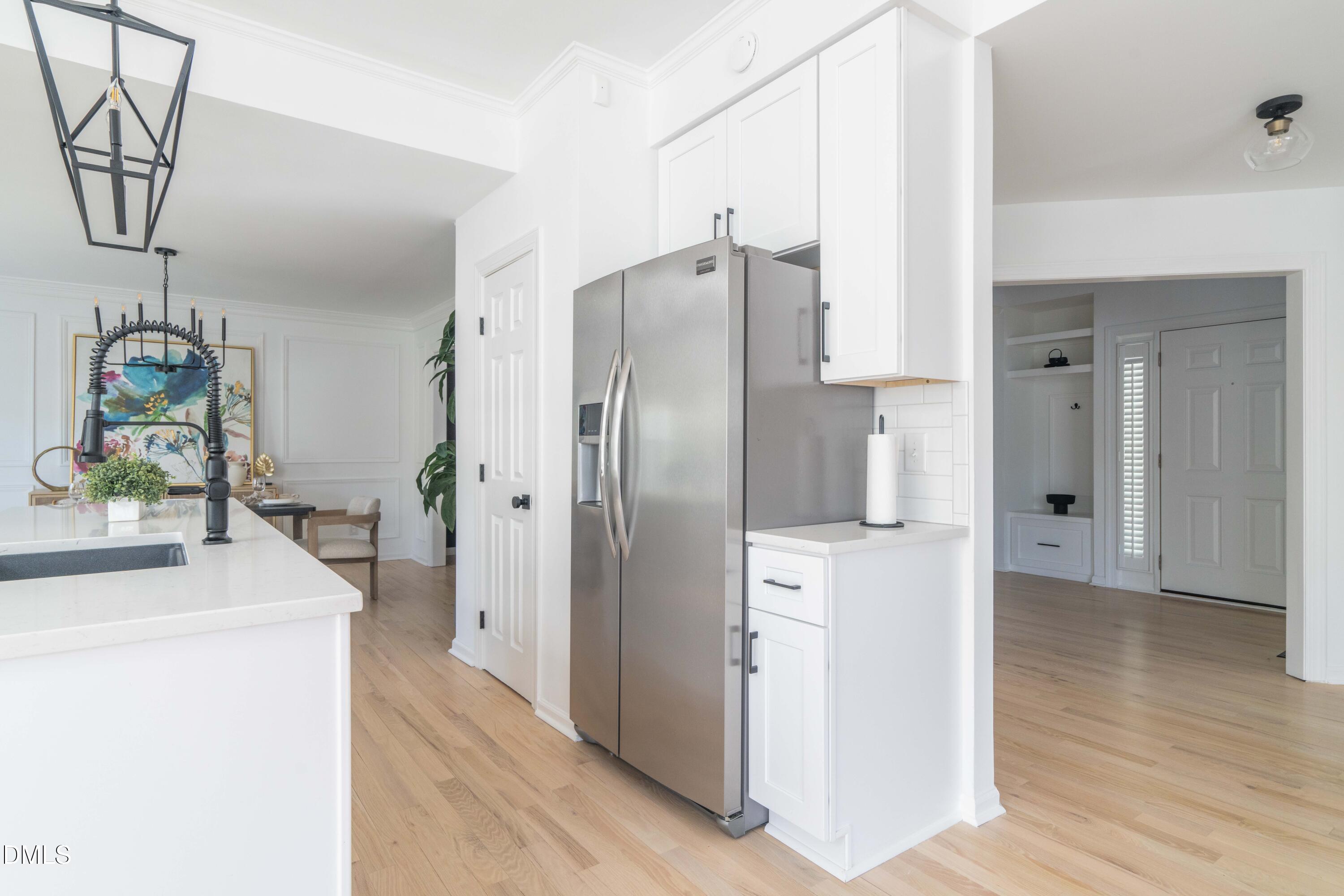 1512 Cooper Falls Lane Raleigh, NC 27614 - Photo 14 of 64 a kitchen with stainless steel appliances a refrigerator sink and stove