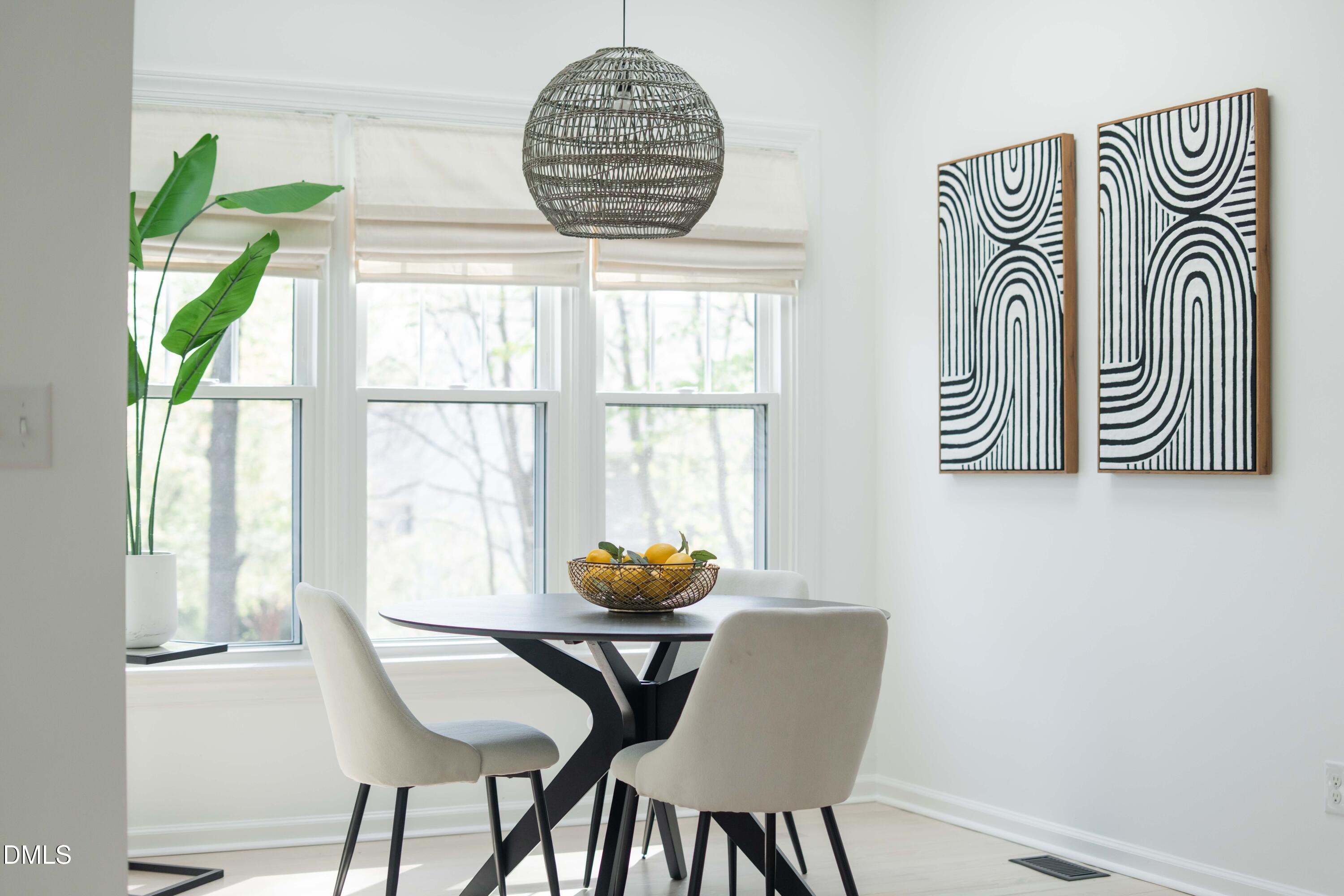 1512 Cooper Falls Lane Raleigh, NC 27614 - Photo 17 of 64 a dining room with furniture and a window