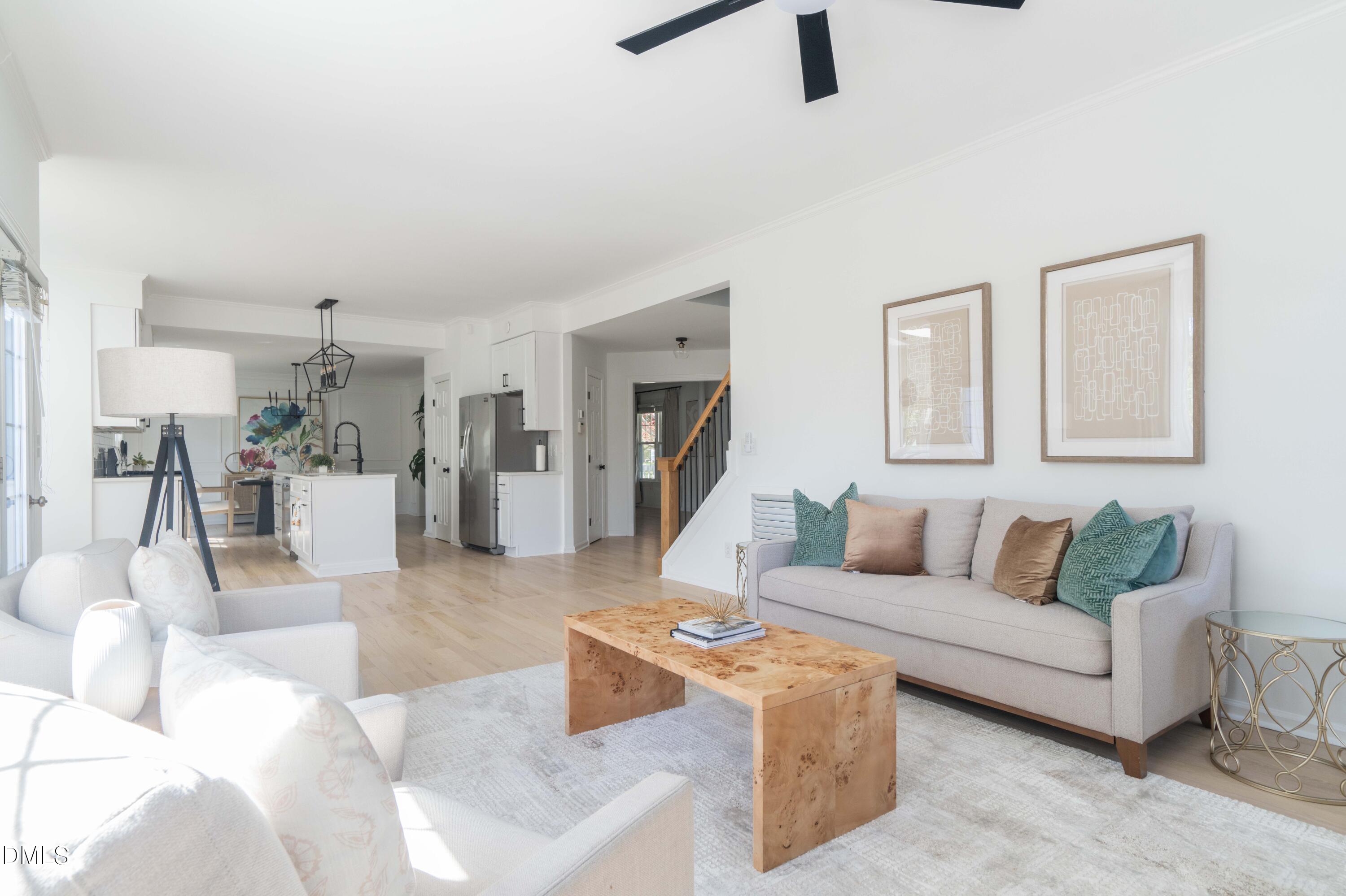 1512 Cooper Falls Lane Raleigh, NC 27614 - Photo 23 of 64 a living room with furniture and a wooden floor