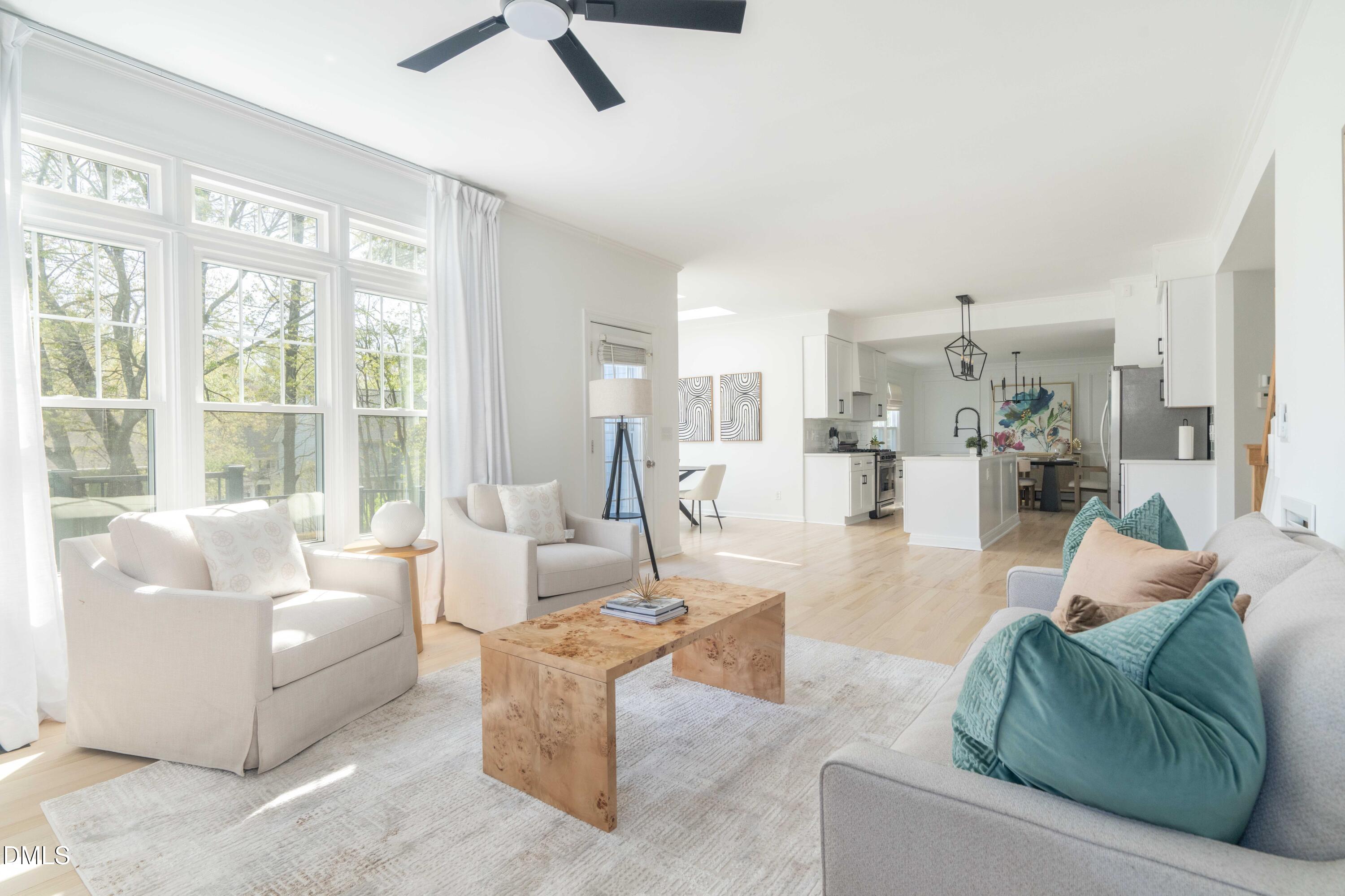 1512 Cooper Falls Lane Raleigh, NC 27614 - Photo 24 of 64 a living room with furniture and a large window