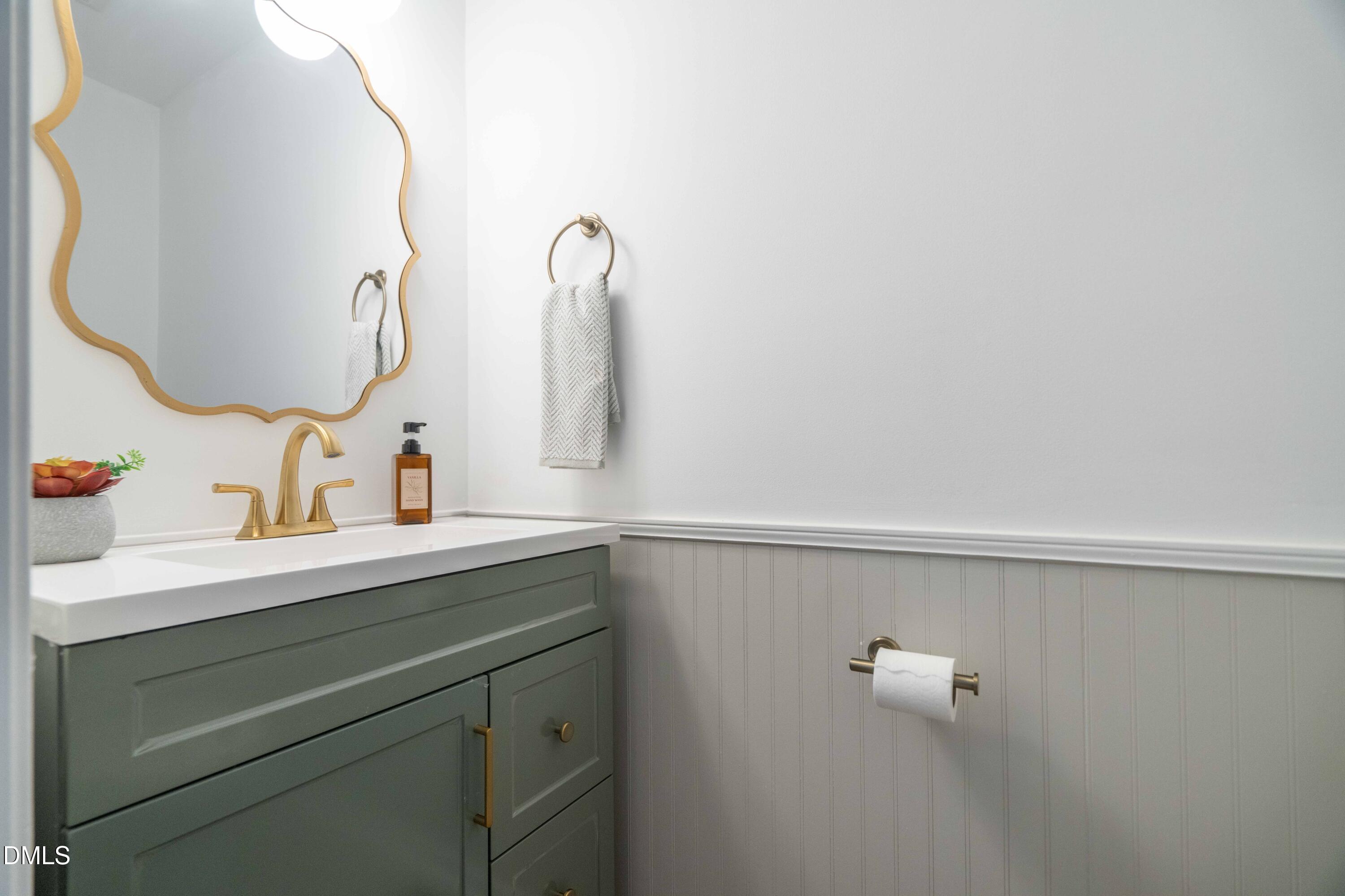 1512 Cooper Falls Lane Raleigh, NC 27614 - Photo 28 of 64 a bathroom with a sink and mirror