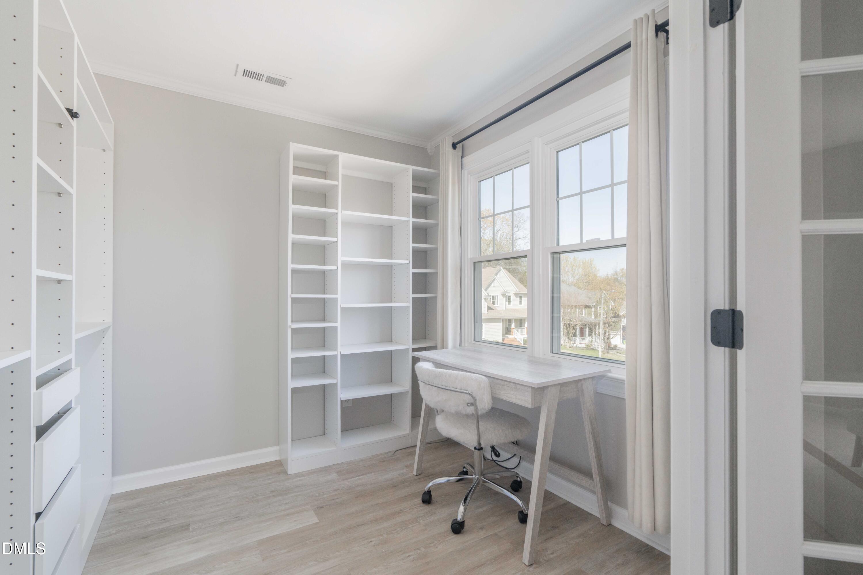 1512 Cooper Falls Lane Raleigh, NC 27614 - Photo 32 of 64 a view of a workspace with furniture and a window