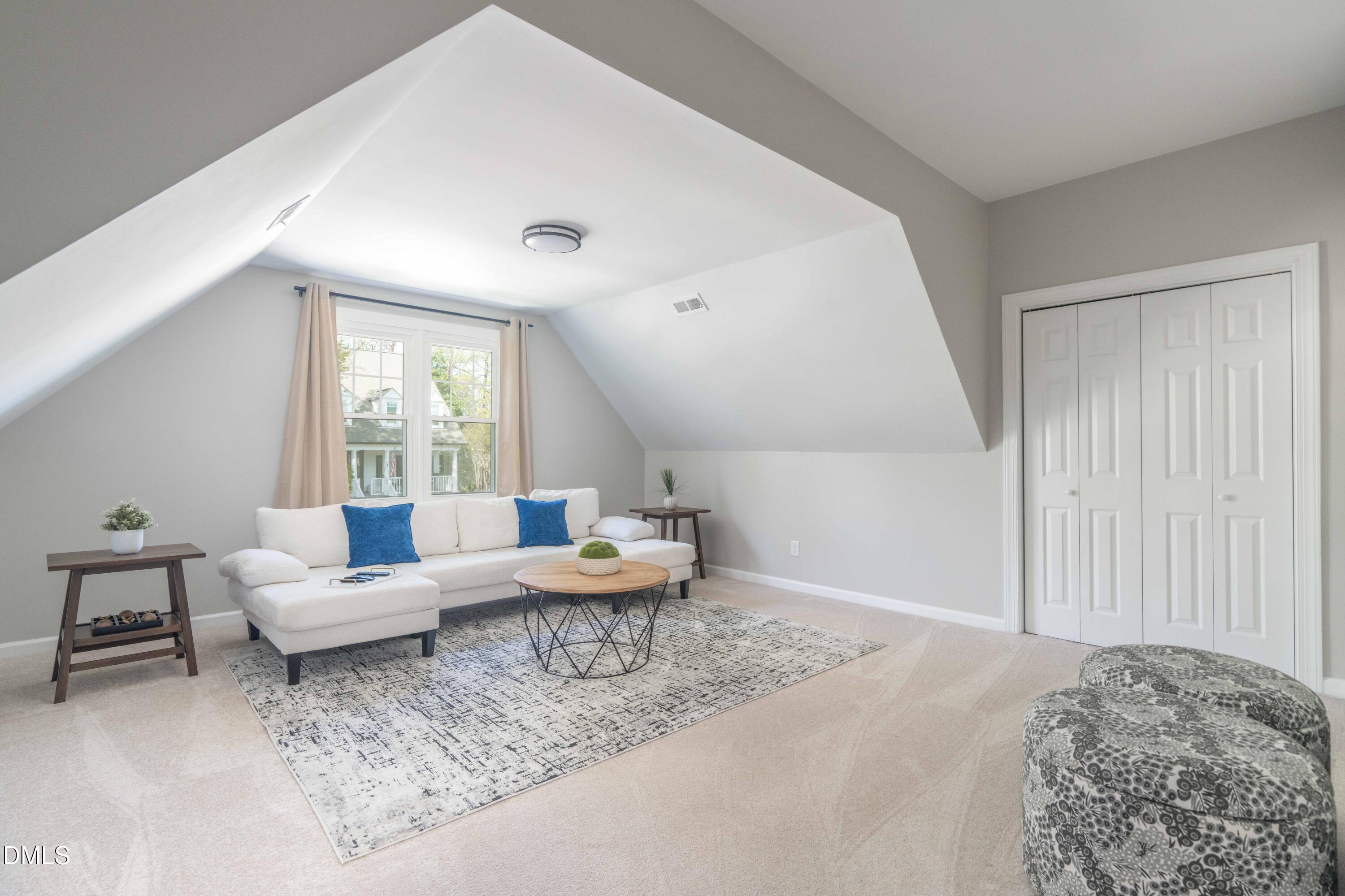 1512 Cooper Falls Lane Raleigh, NC 27614 - Photo 40 of 64 a living room with furniture and a large window