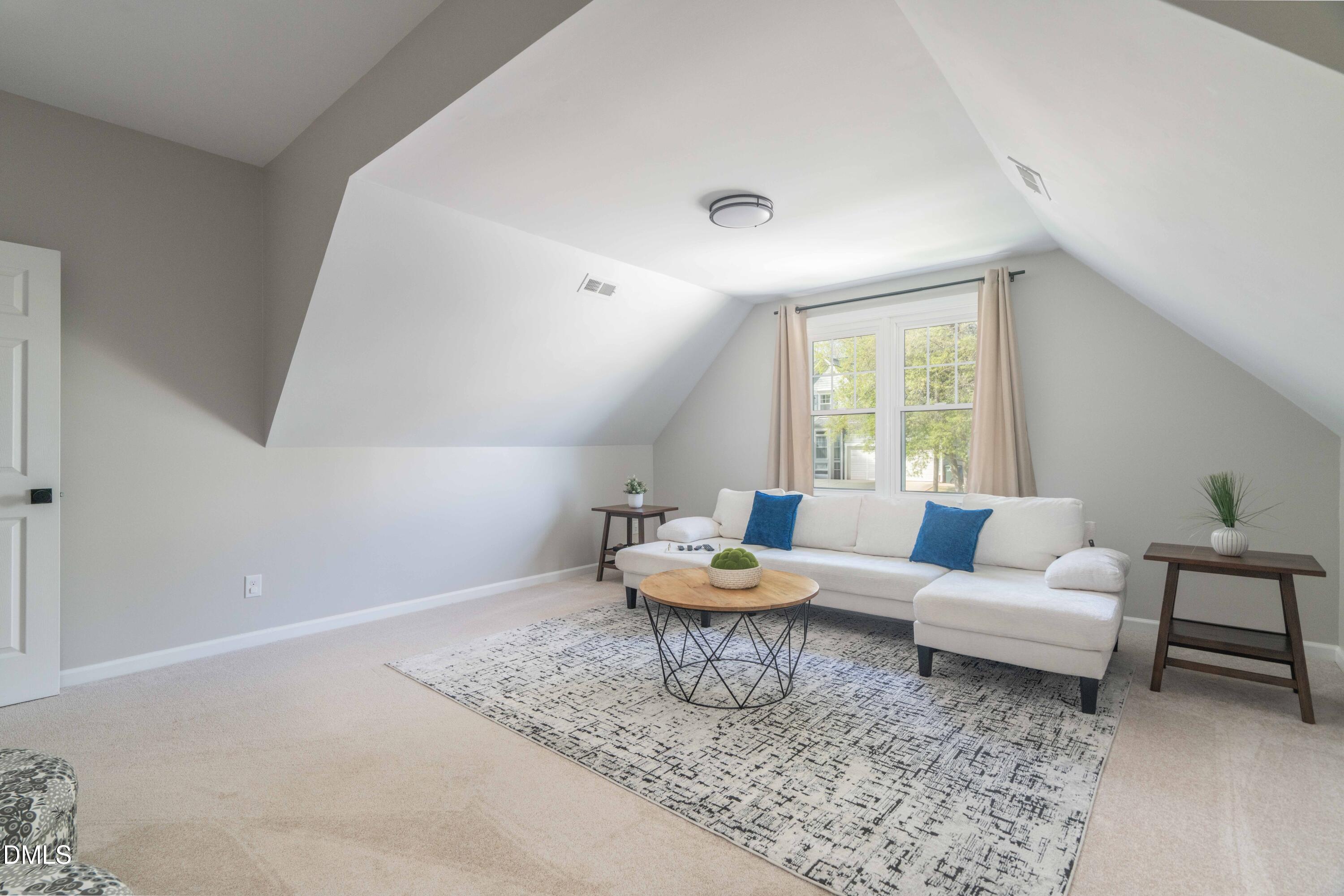 1512 Cooper Falls Lane Raleigh, NC 27614 - Photo 41 of 64 a living room with furniture and a large window